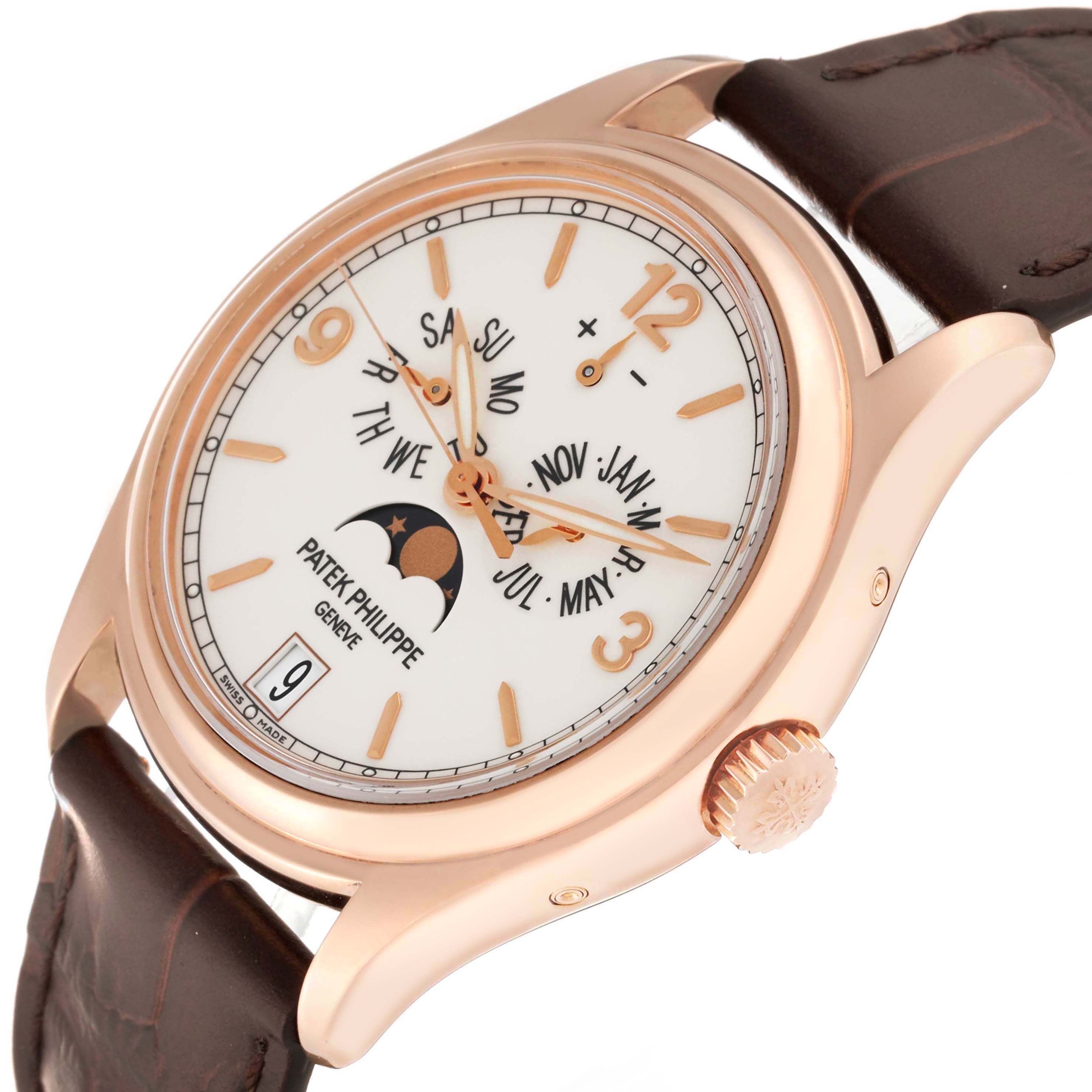 The image shows a Patek Philippe Complications 5146R-001 Men's Rose Gold White Dial 5146R-001 Men's Rose Gold White Dial watch at an oblique angle, displaying the dial, crown, and part of the strap.