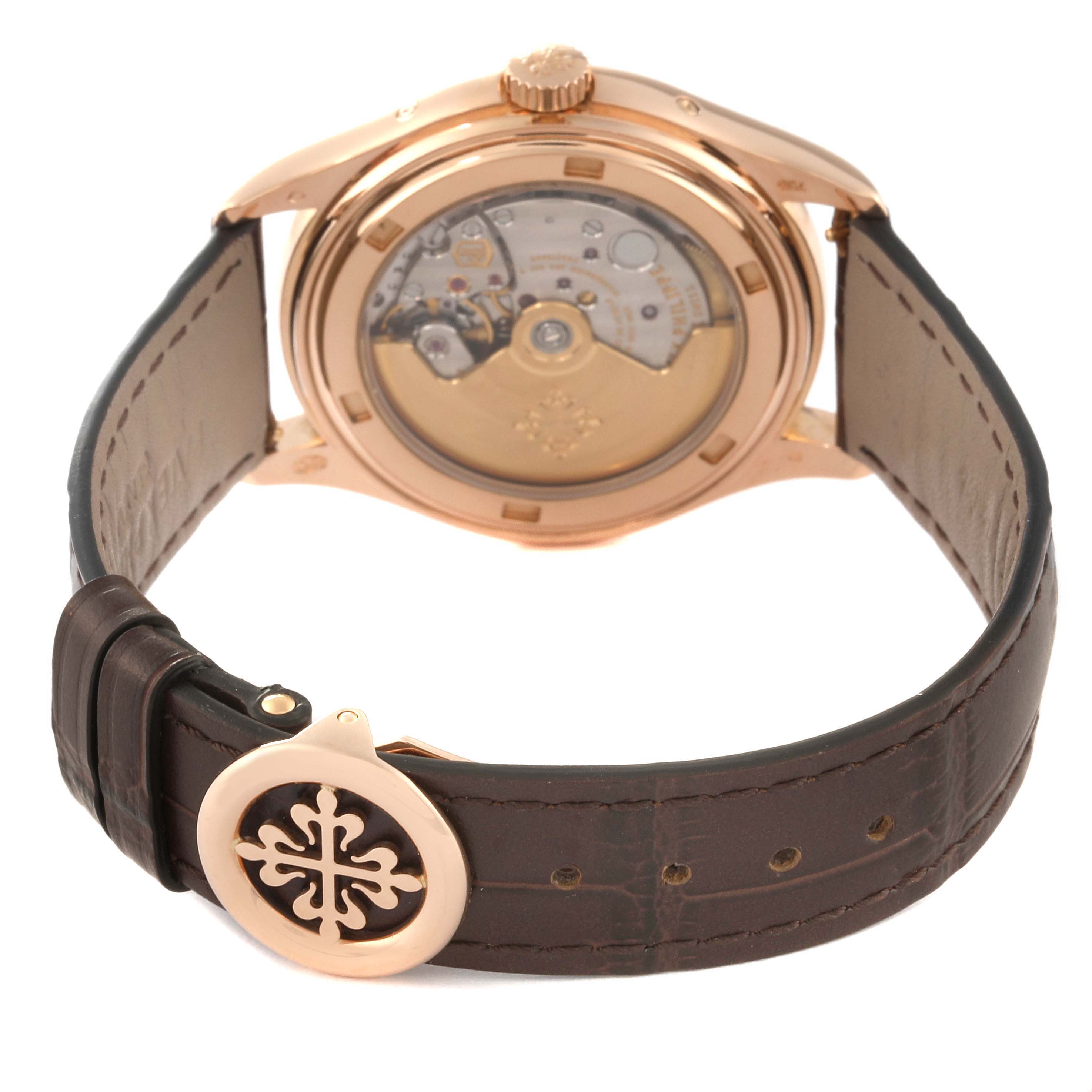 The image shows the back view of a Patek Philippe Complications 5146R-001 Men's Rose Gold White Dial 5146R-001 Men's Rose Gold White Dial model watch displaying its transparent case back and strap clasp.