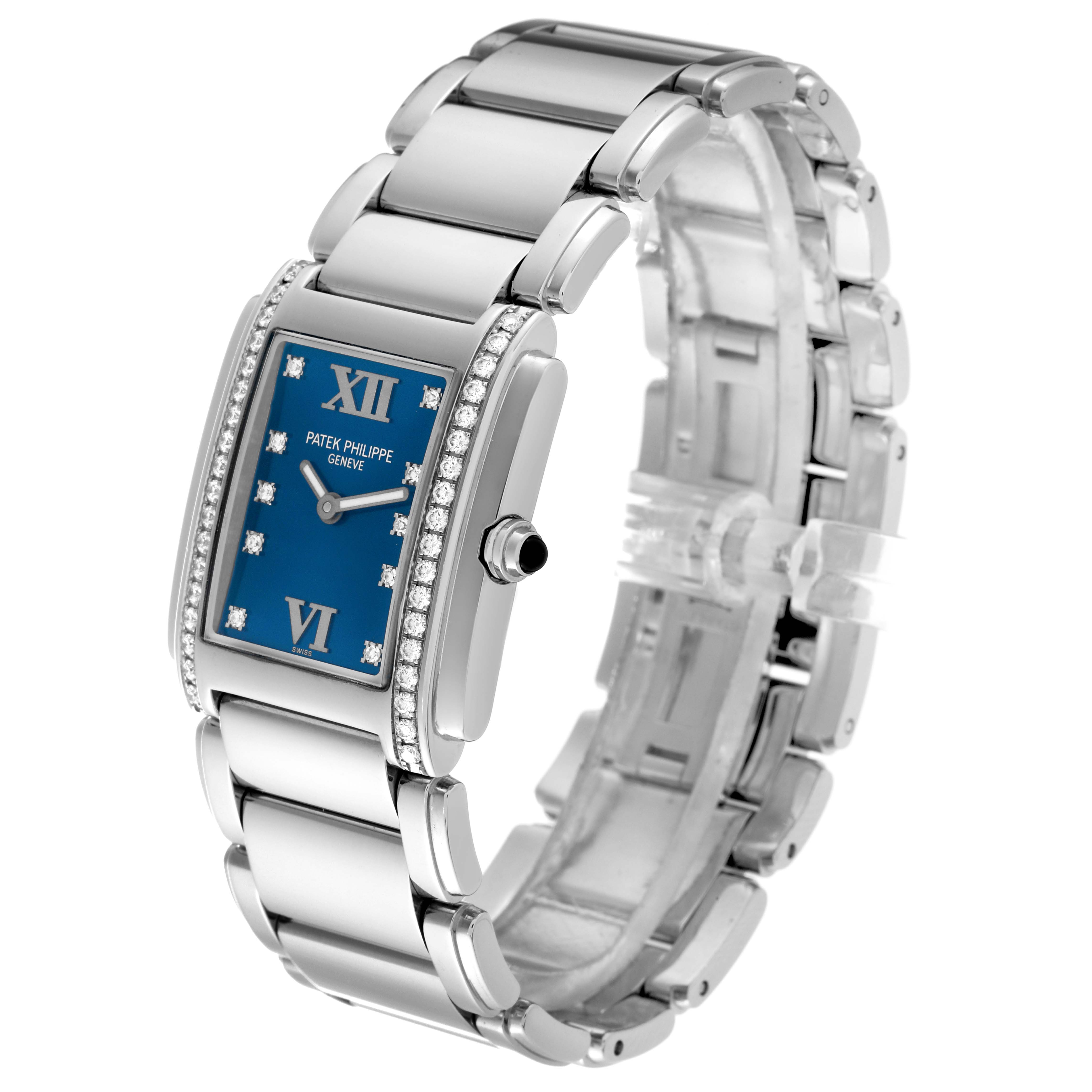 A Patek Philippe Twenty-4 4910/10A-012 Women's Stainless Steel Blue Dial 4910/10A-012 Women's Stainless Steel Blue Dial watch is shown at an angle revealing the bracelet, blue dial, and diamond-set bezel.