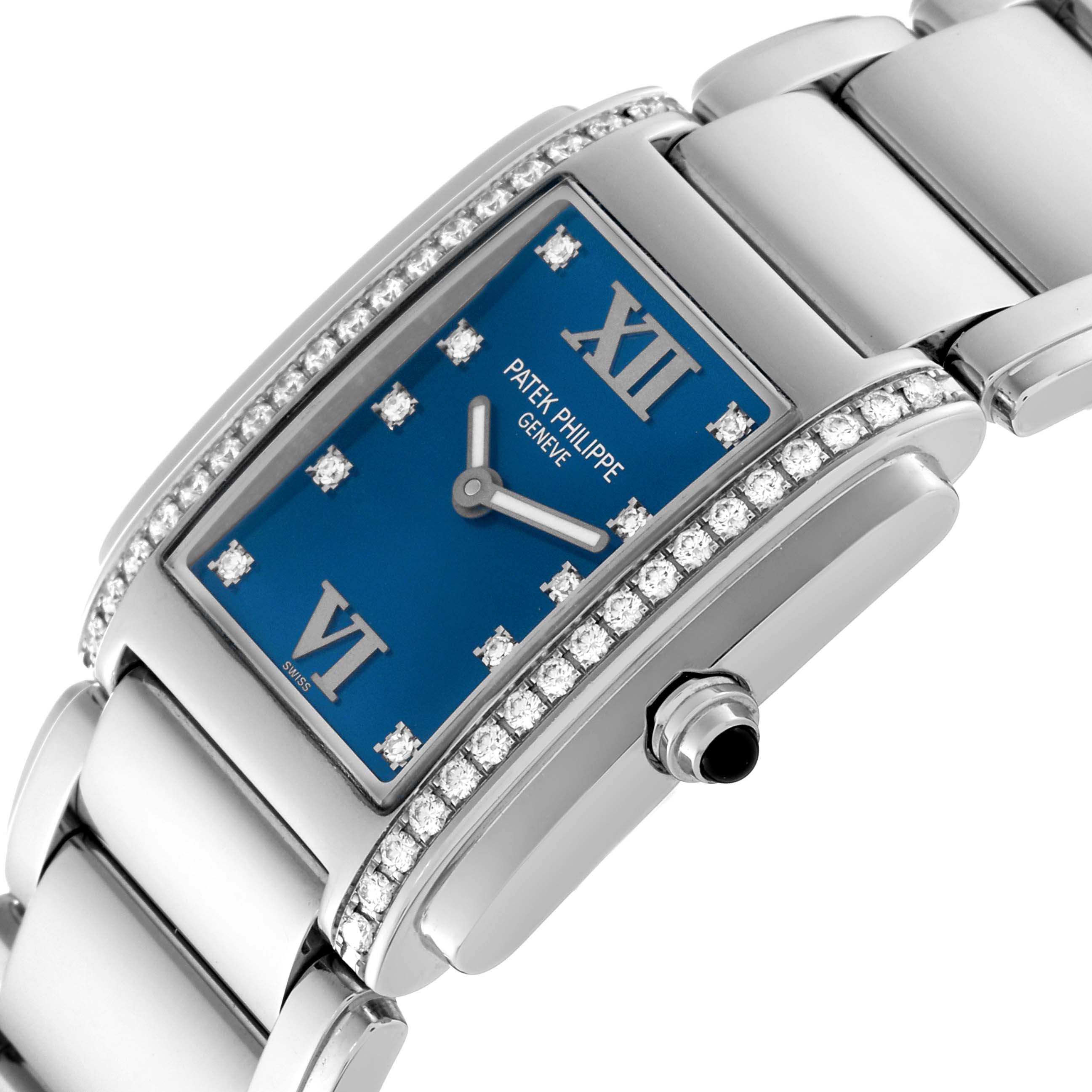 The image shows a Patek Philippe Twenty-4 4910/10A-012 Women's Stainless Steel Blue Dial 4910/10A-012 Women's Stainless Steel Blue Dial watch angled to display the dial, bracelet, and crown.