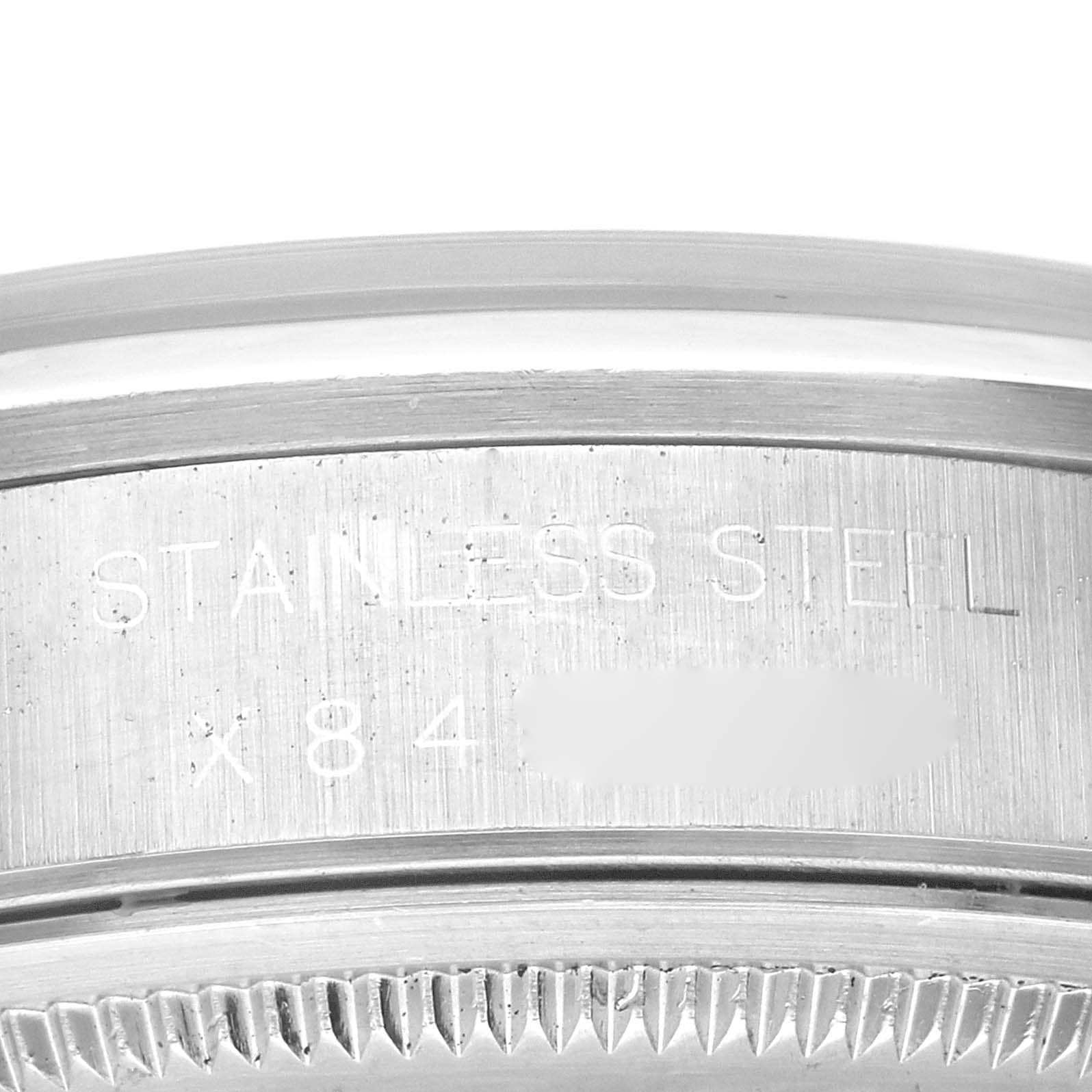 The image shows a close-up of the side of the case back of a Rolex Air-King 14000 Men's Stainless Steel Silver Dial 14000 Men's Stainless Steel Silver Dial watch, highlighting the stainless steel engraving.
