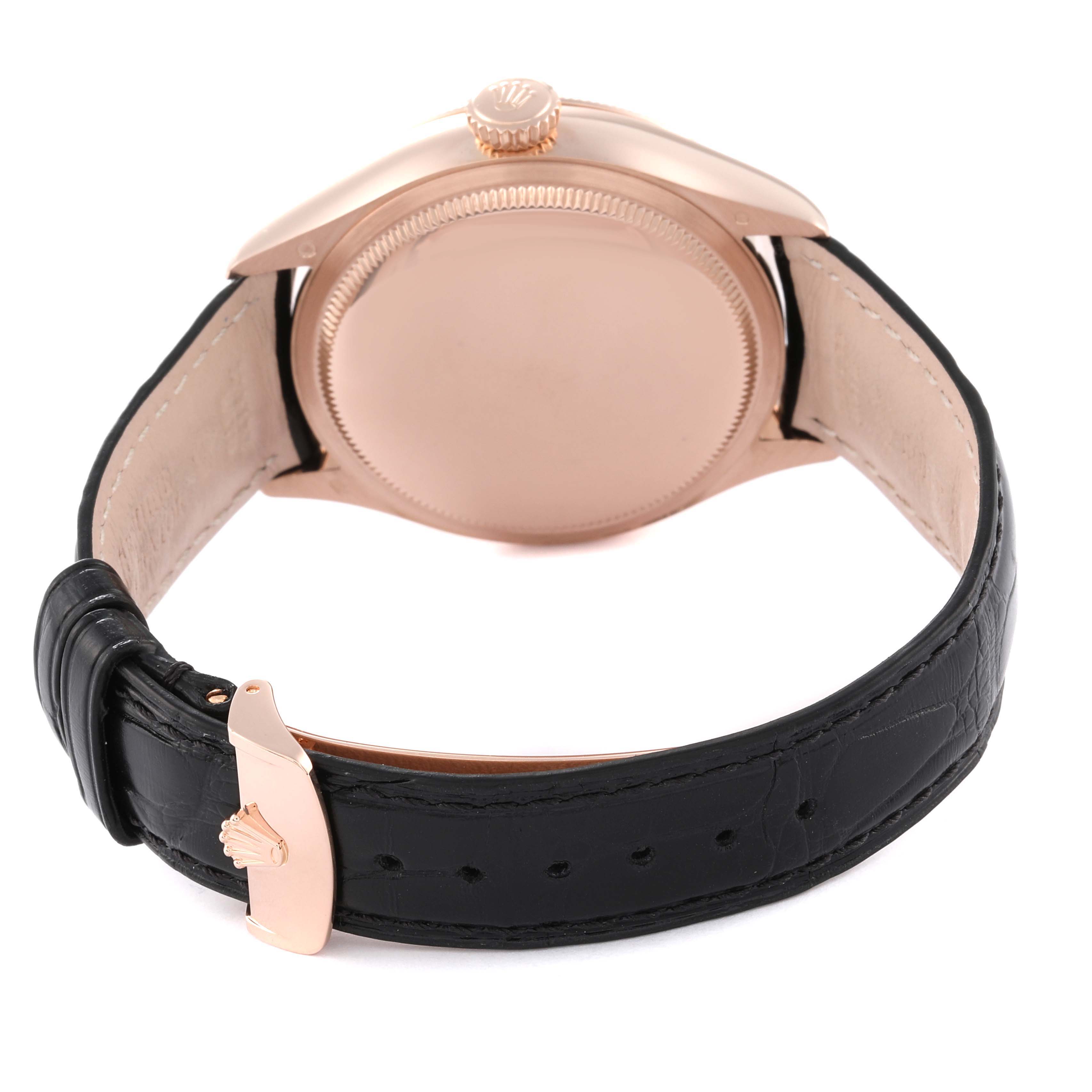 The image shows the back of a Rolex Cellini 50535 Men's Rose Gold White Dial 50535 Men's Rose Gold White Dial watch with a leather strap and a close-up of the crown.