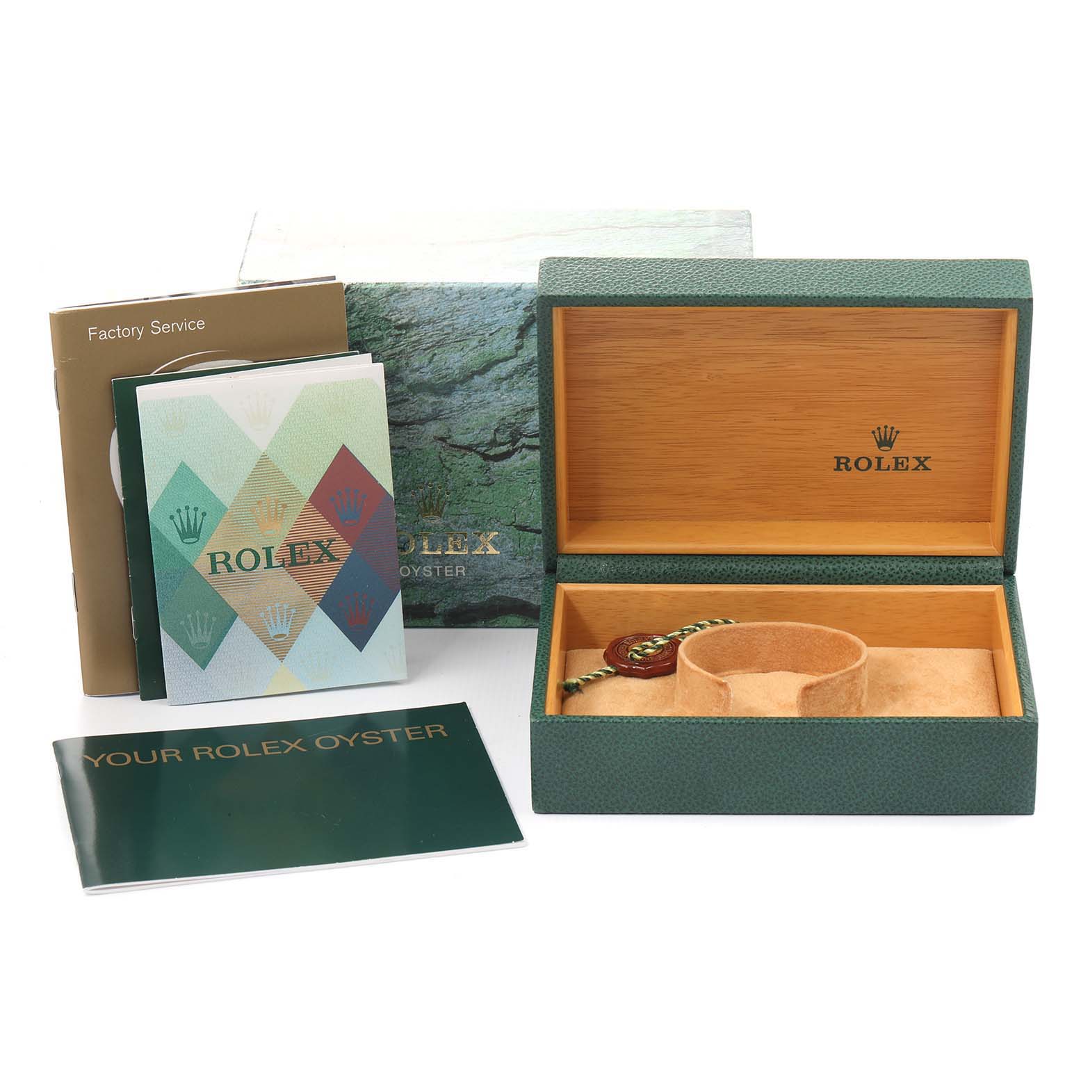 The image shows the open packaging of a Date model Rolex watch, including the watch box, booklets, and accessories.