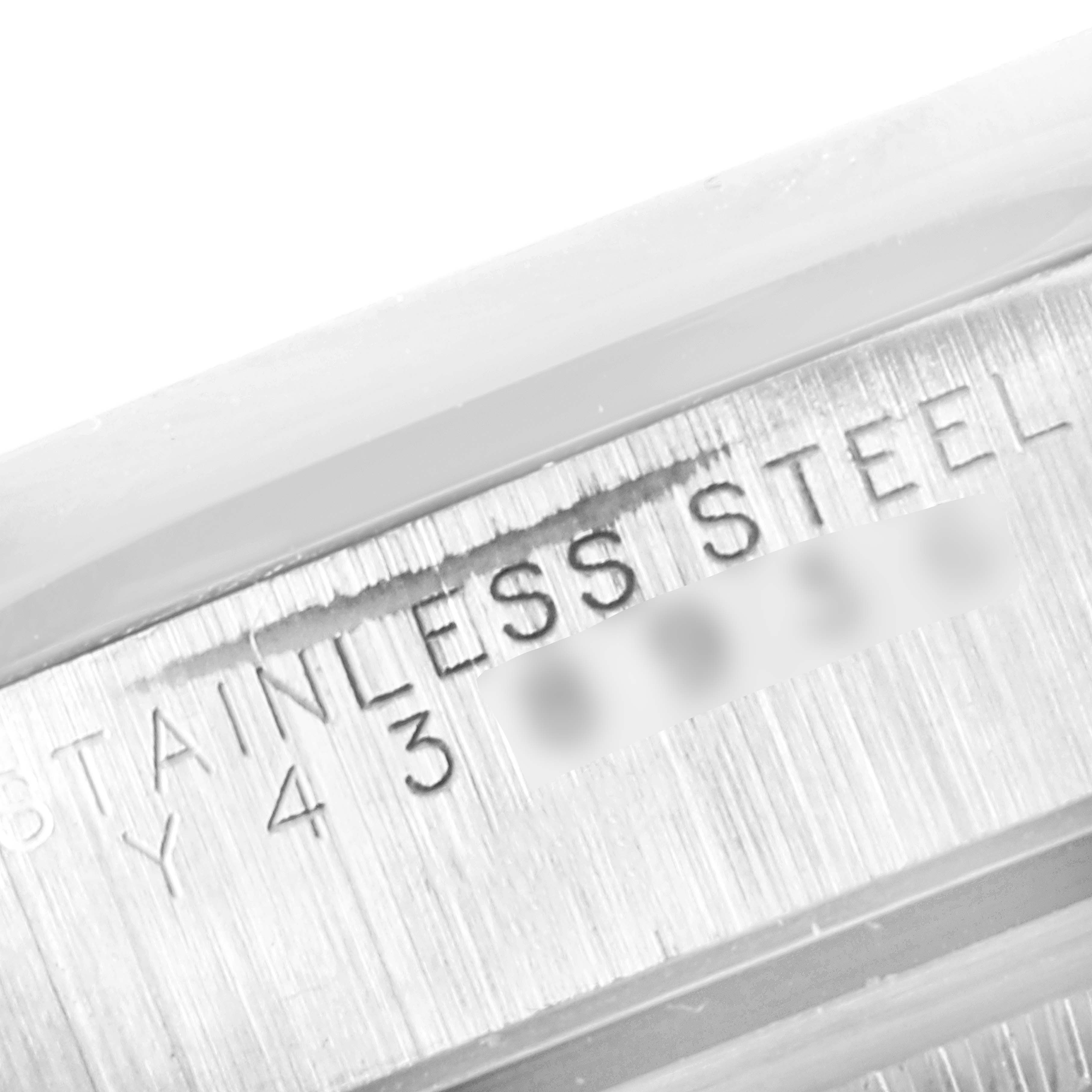 Close-up view of the stainless steel casing with the engraving on a Rolex Date 15200 Men's Stainless Steel Black Dial 15200 Men's Stainless Steel Black Dial model watch.