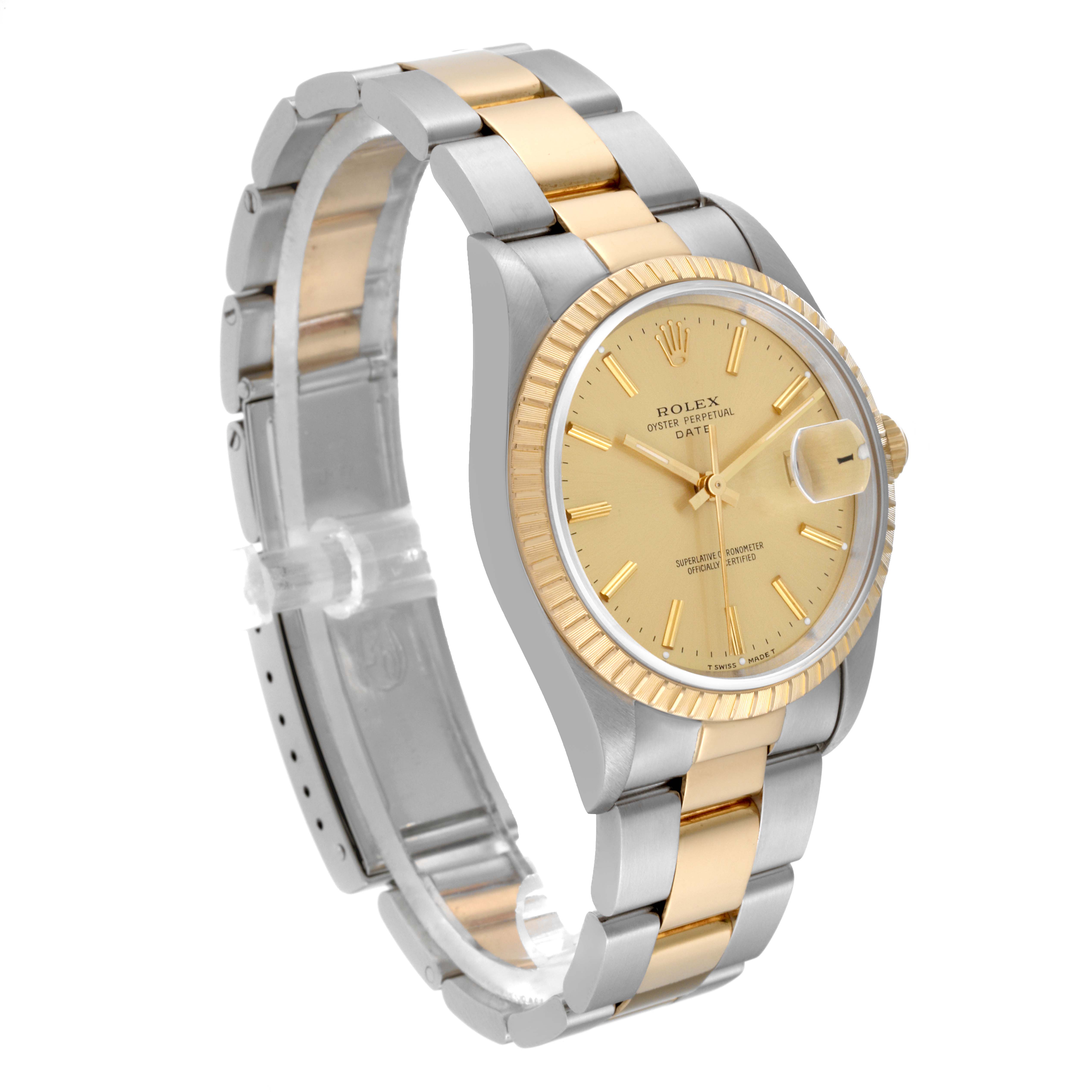 The Rolex Datejust 15223 Men's Steel and Gold (two tone) Champagne Dial 15223 Men's Steel and Gold (two tone) Champagne Dial watch is shown at an angle featuring its silver and gold band, gold dial, and fluted bezel.