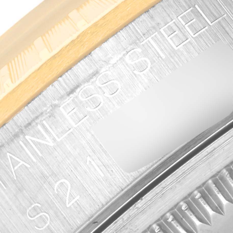 The image shows a close-up of the bezel and side of a Rolex Datejust 15223 Men's Steel and Gold (two tone) Champagne Dial 15223 Men's Steel and Gold (two tone) Champagne Dial watch, highlighting the stainless steel material.