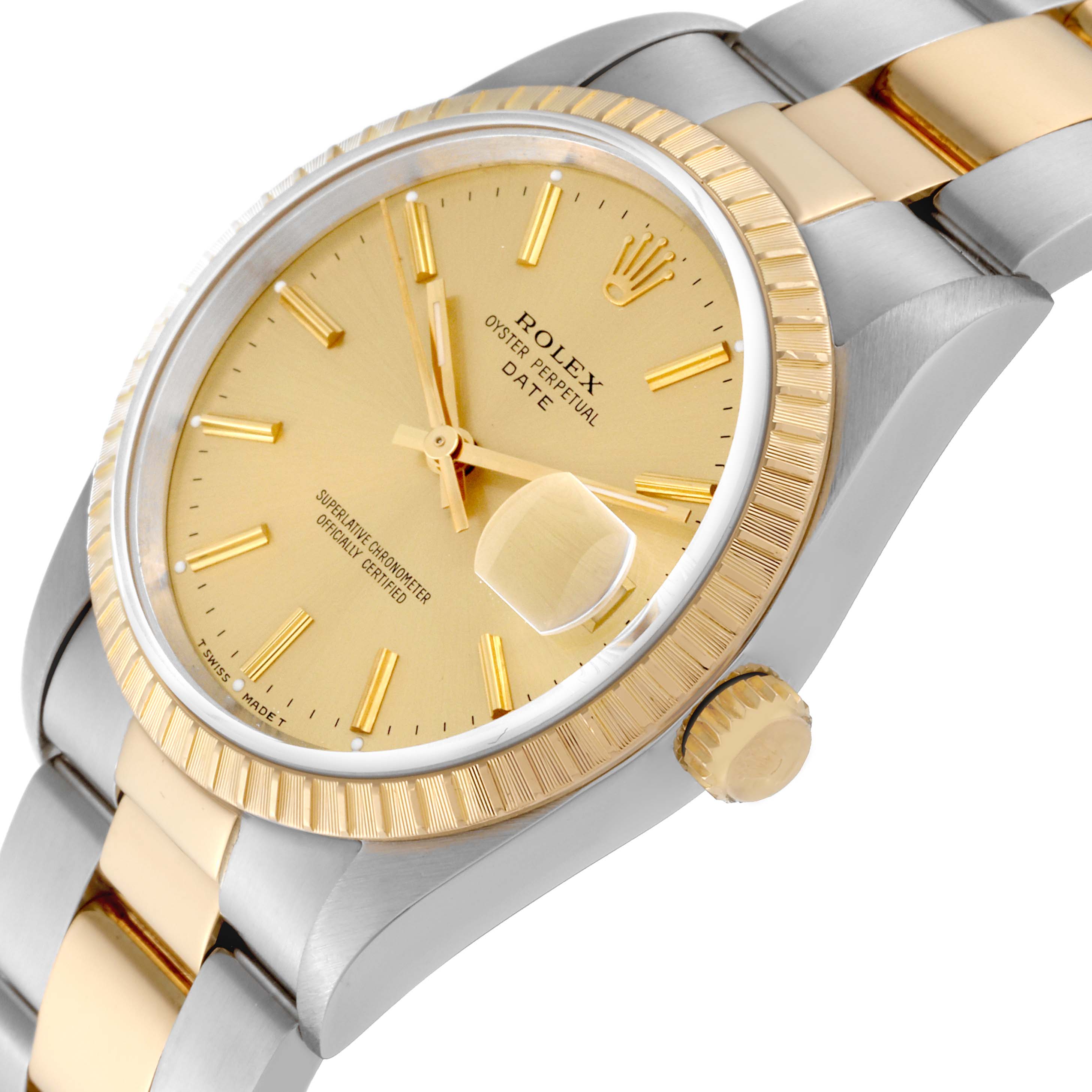 The image shows a close-up of the Rolex Datejust 15223 Men's Steel and Gold (two tone) Champagne Dial 15223 Men's Steel and Gold (two tone) Champagne Dial watch, angled to display its gold dial, bezel, crown, and part of the two-tone bracelet.