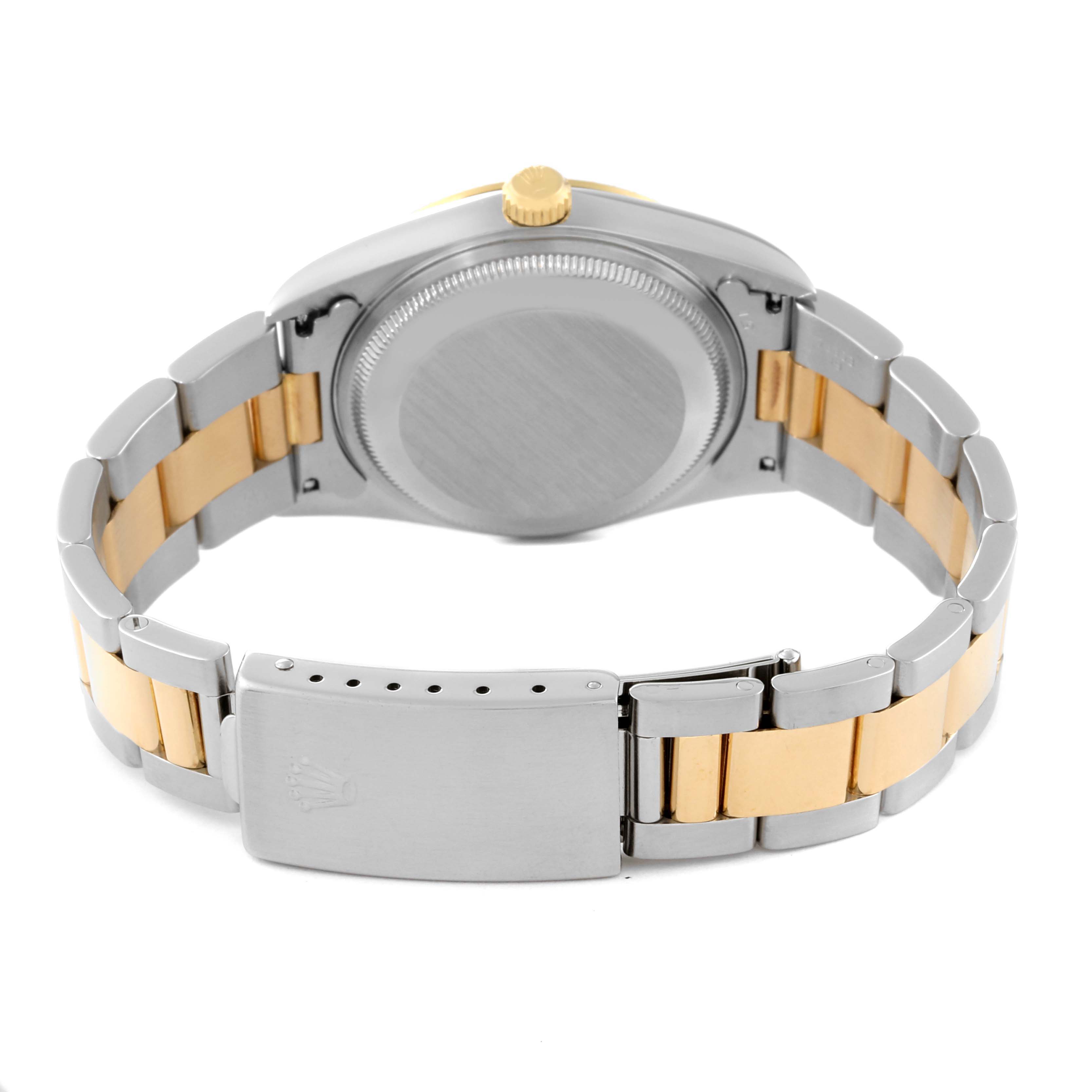 This image shows the back view of a Rolex Datejust 15223 Men's Steel and Gold (two tone) Champagne Dial 15223 Men's Steel and Gold (two tone) Champagne Dial watch, highlighting its stainless steel and gold bracelet, case back, and clasp.