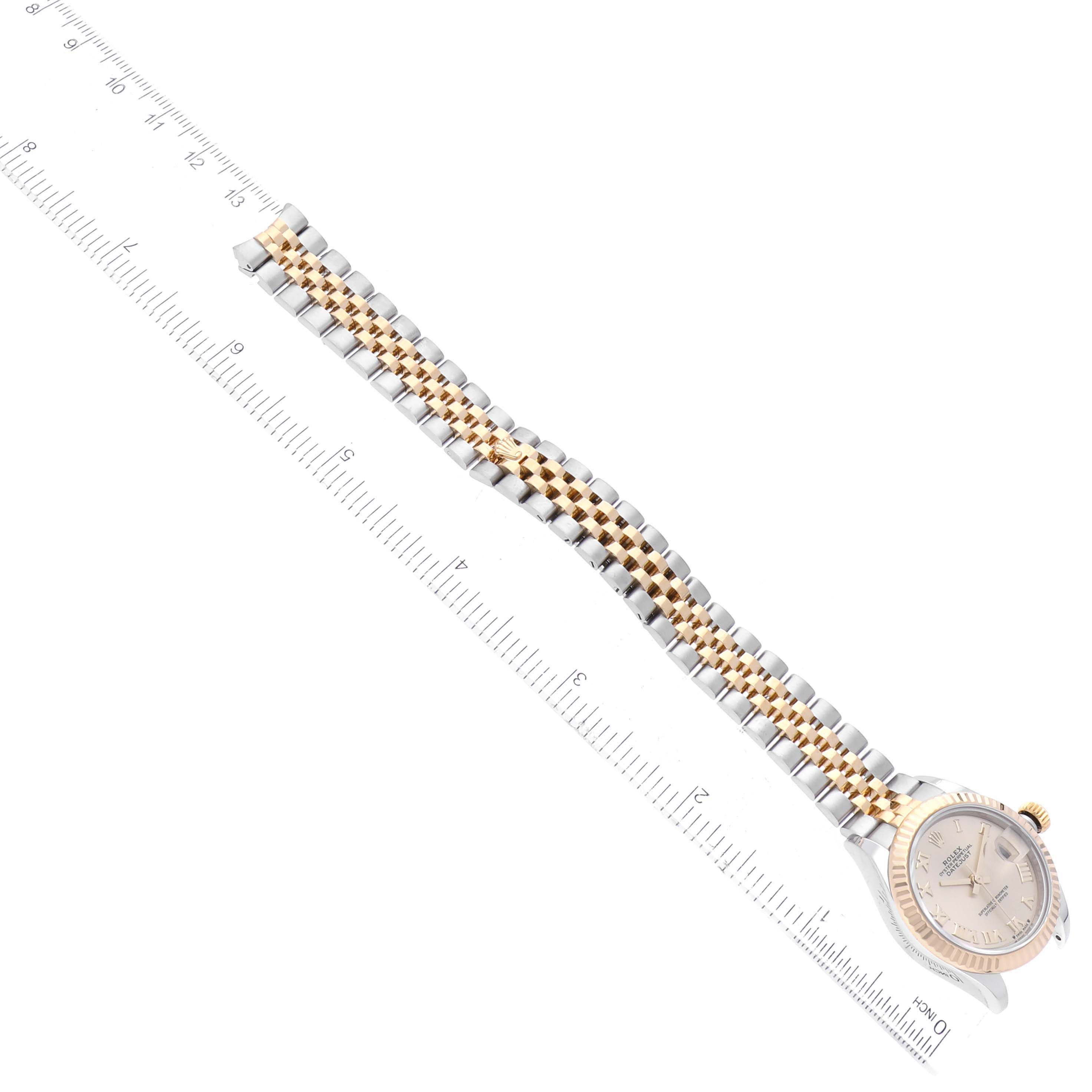 The image shows a Rolex Datejust 279173 Women's Steel and Gold (two tone) Champagne Dial 279173 Women's Steel and Gold (two tone) Champagne Dial watch at an aerial angle, highlighting its two-tone bracelet alongside a measuring ruler.