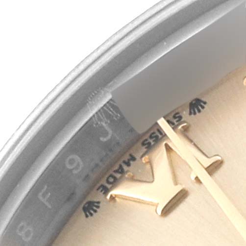 This close-up image shows a partial view of the dial and markers, including the "Swiss Made" text, of a Rolex Datejust 279173 Women's Steel and Gold (two tone) Champagne Dial 279173 Women's Steel and Gold (two tone) Champagne Dial watch.