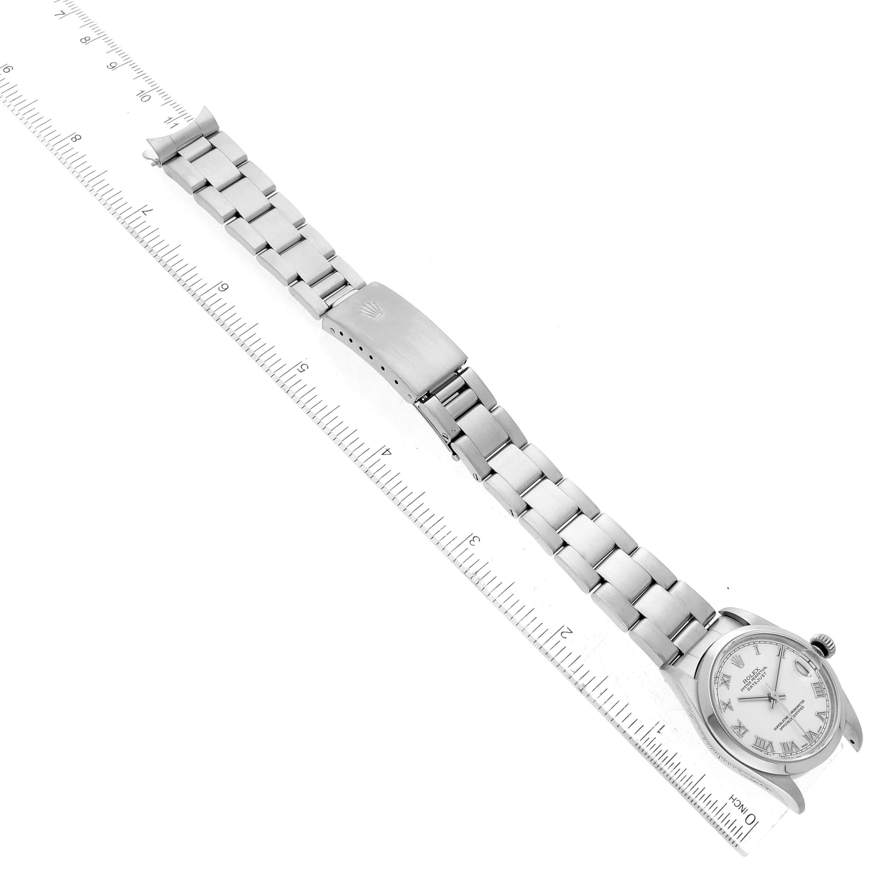 The image shows the Rolex Mid-Size 78240 Women's Stainless Steel White Dial 78240 Women's Stainless Steel White Dial watch laid flat with the face, bracelet, and clasp visible beside a ruler for scale.