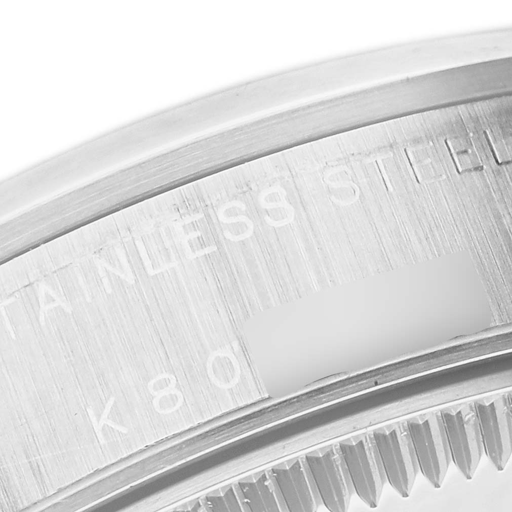 This image shows a close-up of the case back edge and serial engraving of a Rolex Mid-Size 78240 Women's Stainless Steel White Dial 78240 Women's Stainless Steel White Dial model in stainless steel.