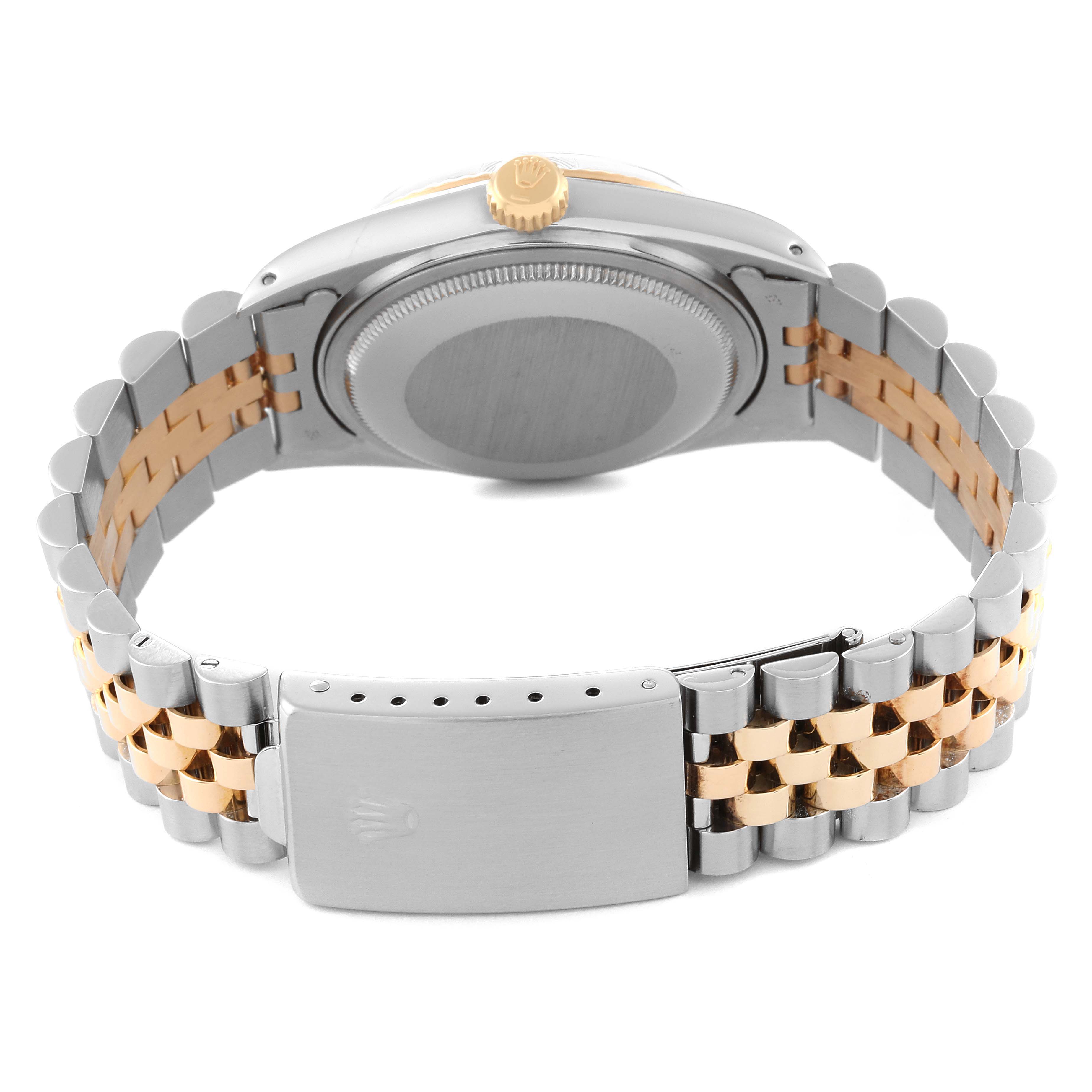 This image shows the back of a Rolex Datejust 16013 Men's Steel and Gold (two tone) Champagne Dial 16013 Men's Steel and Gold (two tone) Champagne Dial watch, including the case back, crown, and the two-tone bracelet with a clasp.