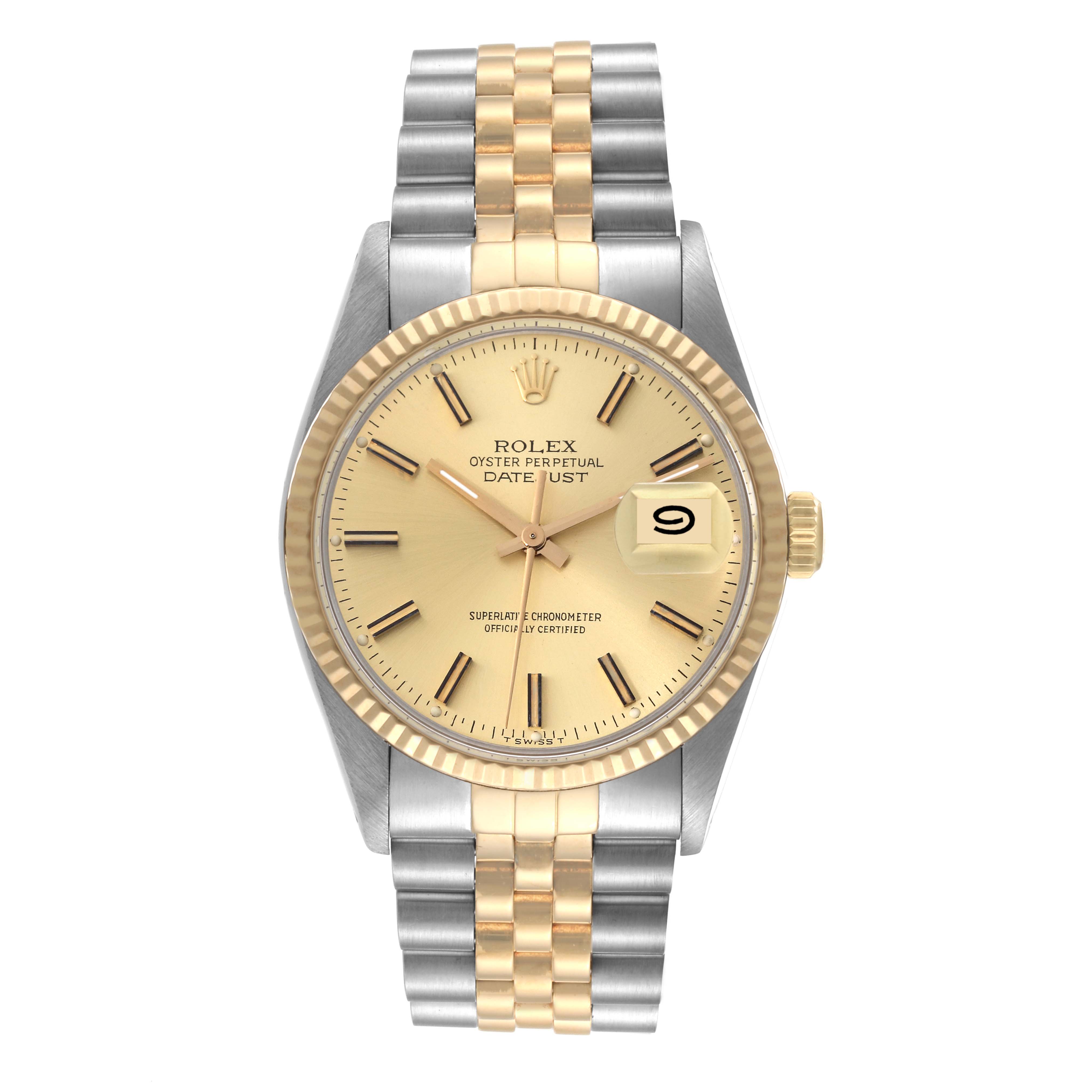 This image shows a Rolex Datejust 16013 Men's Steel and Gold (two tone) Champagne Dial 16013 Men's Steel and Gold (two tone) Champagne Dial watch from a front angle, featuring a gold dial, fluted bezel, and two-tone bracelet.