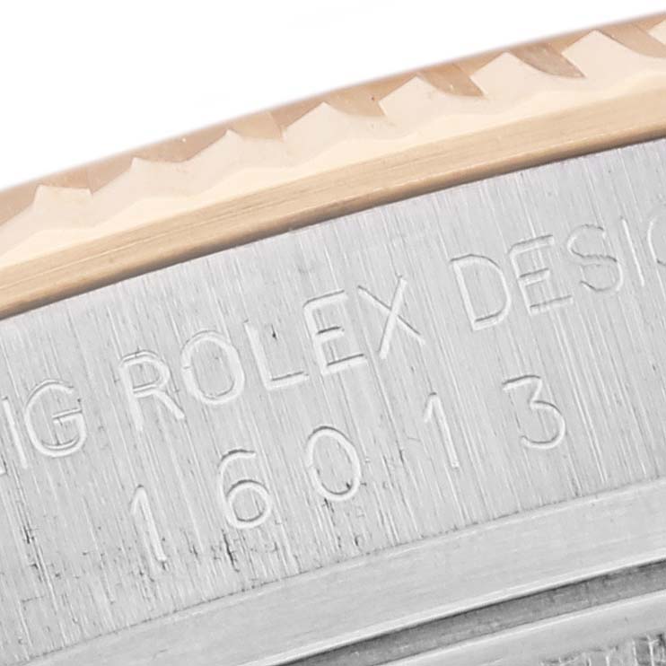 This close-up image shows the engraved case back with model number on the side of a Rolex Vintage Collection 16013 Men's Steel and Gold (two tone) Champagne Dial 16013 Men's Steel and Gold (two tone) Champagne Dial watch bezel.