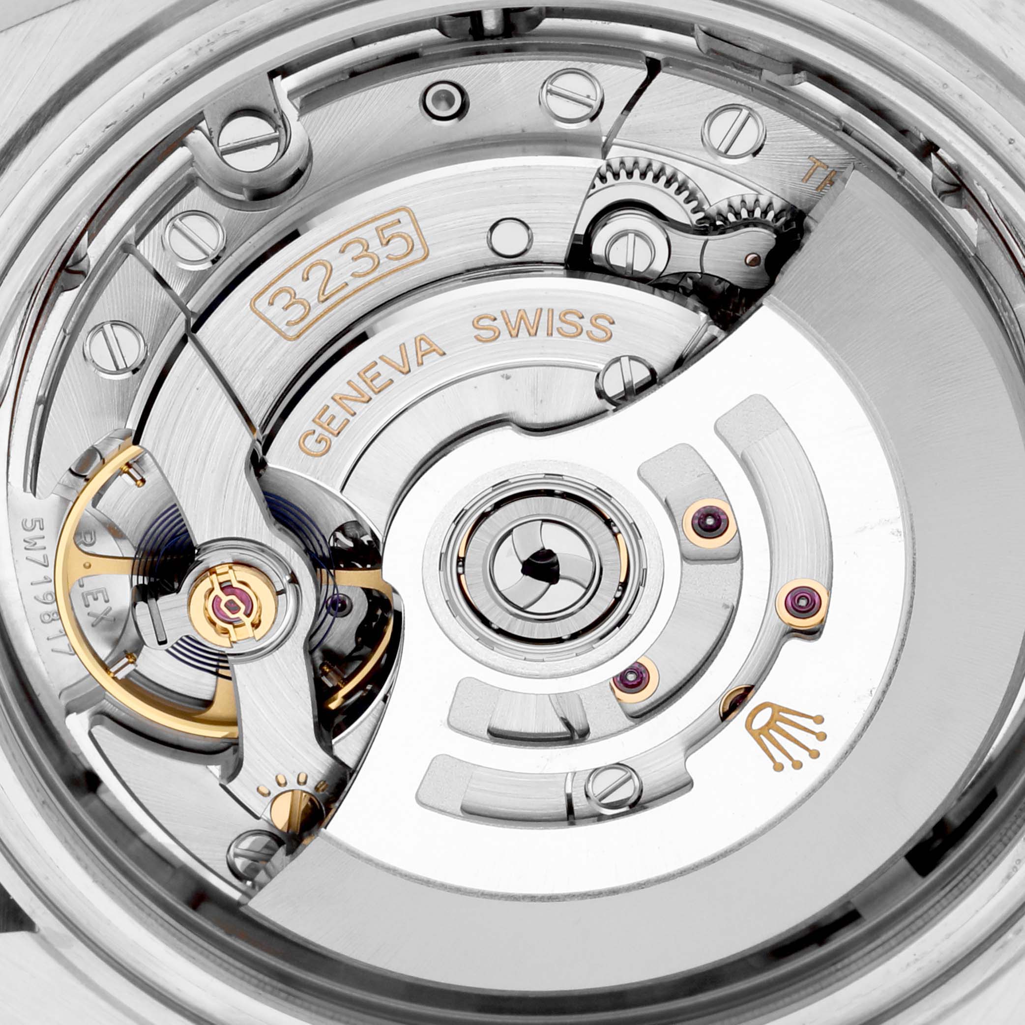 The image shows the intricate movement of the Rolex Datejust 41 126331 Men's Steel and Gold (two tone) Pink Dial 126331 Men's Steel and Gold (two tone) Pink Dial model, showcasing the caliber 3235 mechanism from a close-up angle.