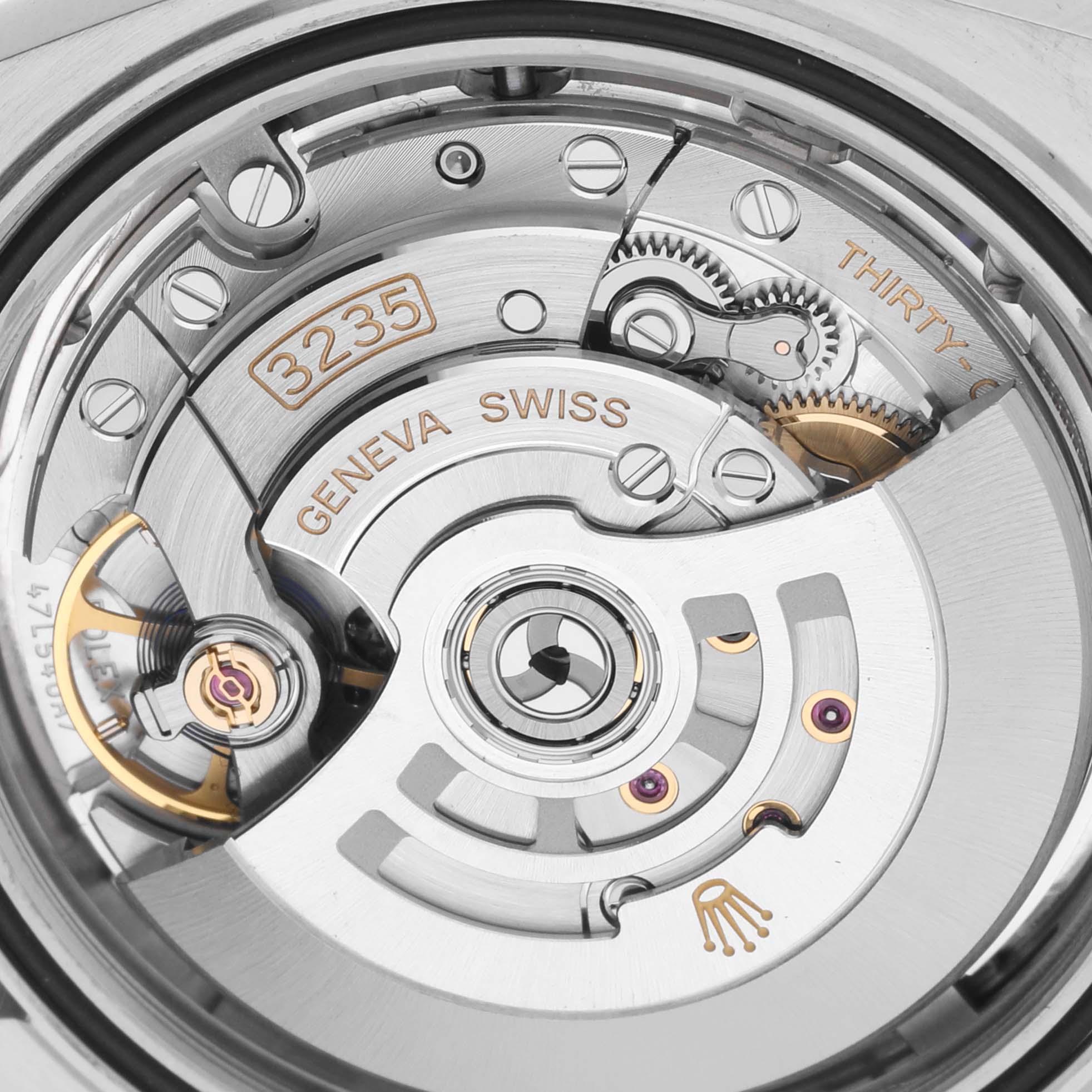 The image shows the intricate internal movement mechanism of the Rolex Datejust 41 126331 Men's Steel and Gold (two tone) Pink Dial 126331 Men's Steel and Gold (two tone) Pink Dial watch, featuring the caliber 3235.