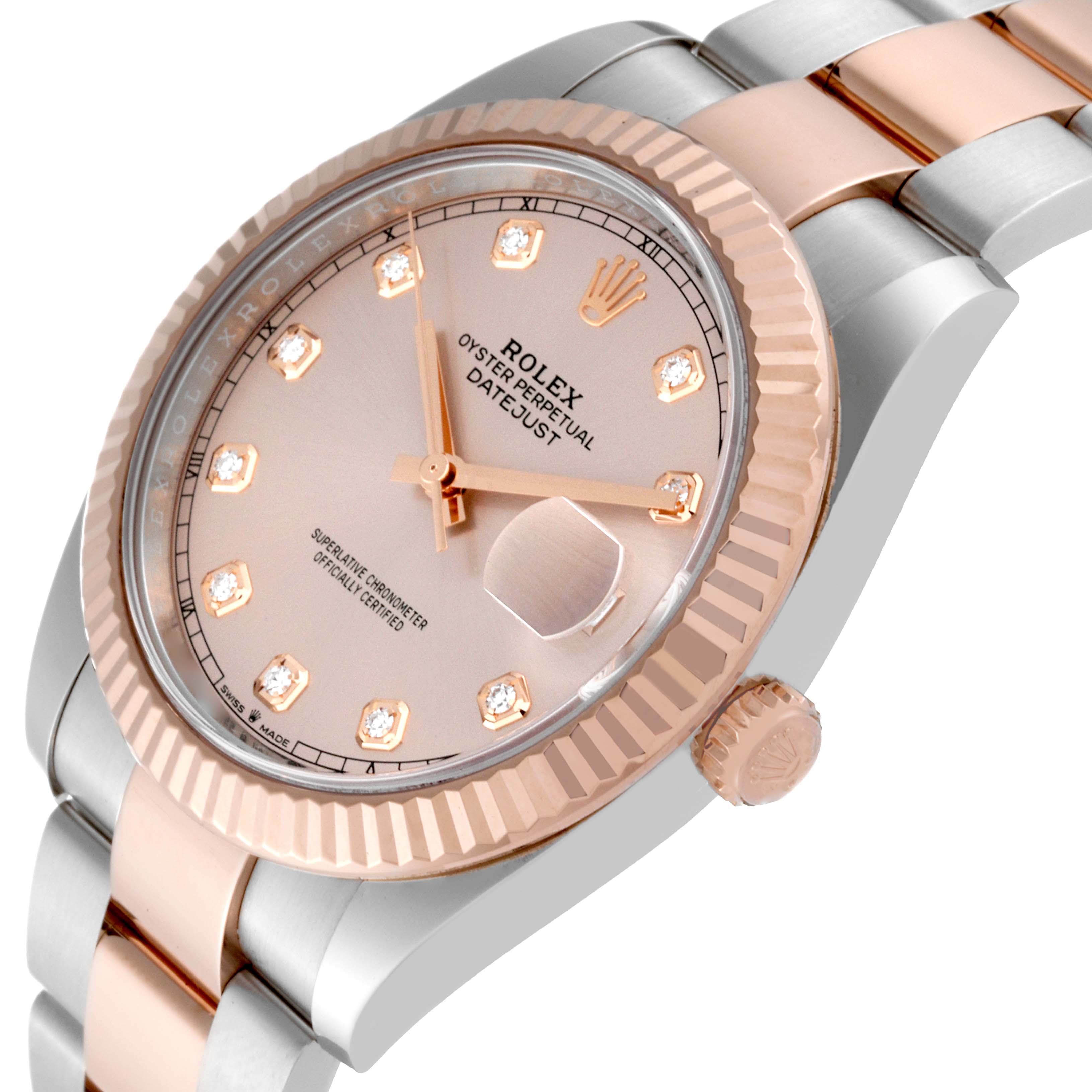 This image shows a close-up, angled view of the dial, bezel, and part of the bracelet of the Rolex Datejust 41 126331 Men's Steel and Gold (two tone) Pink Dial 126331 Men's Steel and Gold (two tone) Pink Dial watch.
