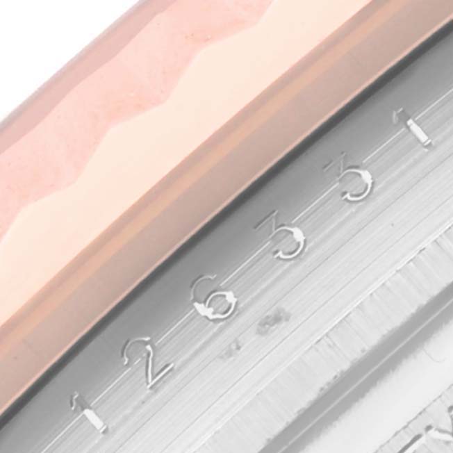 A close-up of the Rolex Datejust 41 126331 Men's Steel and Gold (two tone) Pink Dial 126331 Men's Steel and Gold (two tone) Pink Dial model showing the date wheel and part of the dial's edge.