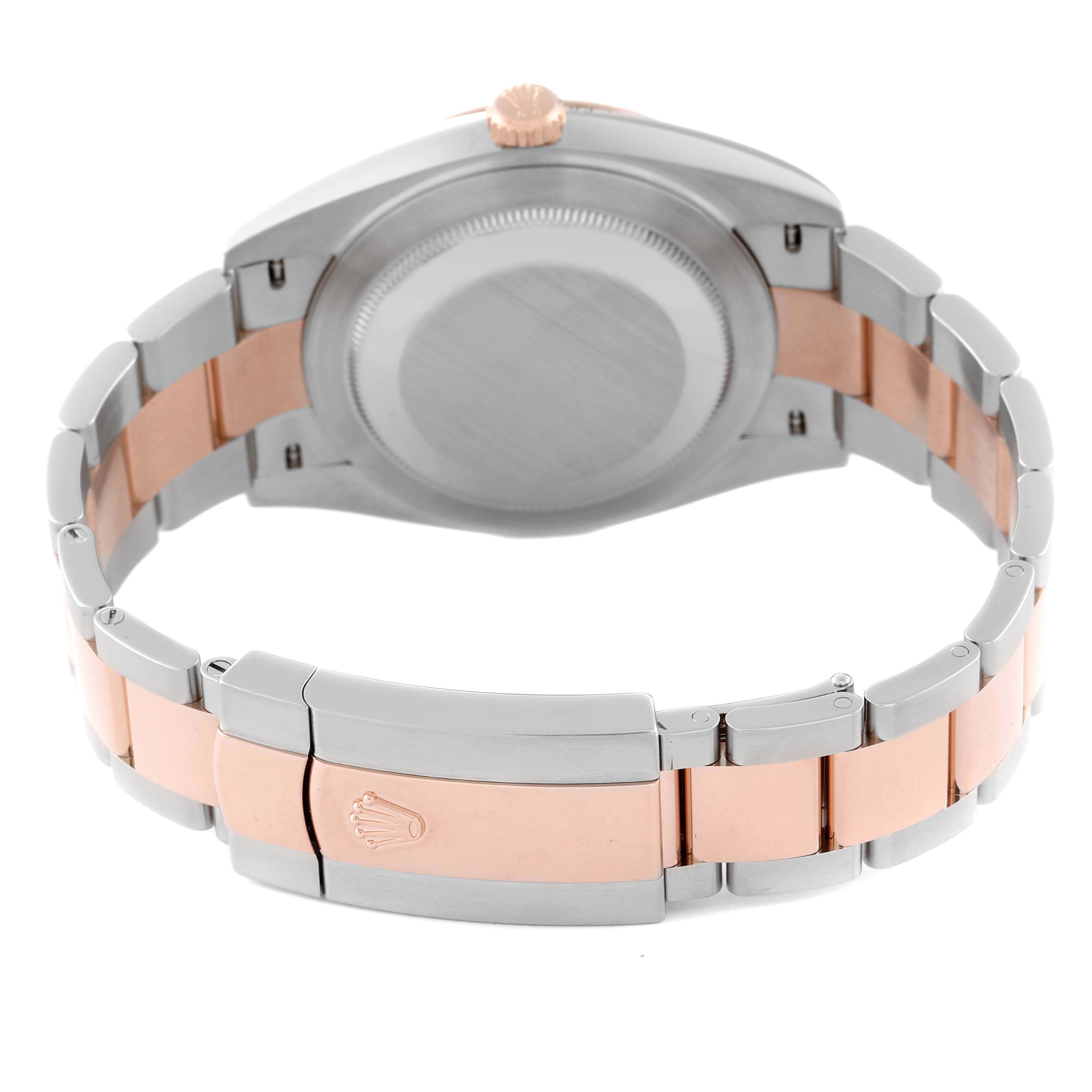 The image shows the back view of a Rolex Datejust 41 126331 Men's Steel and Gold (two tone) Pink Dial 126331 Men's Steel and Gold (two tone) Pink Dial, highlighting its case back, crown, and two-tone bracelet.