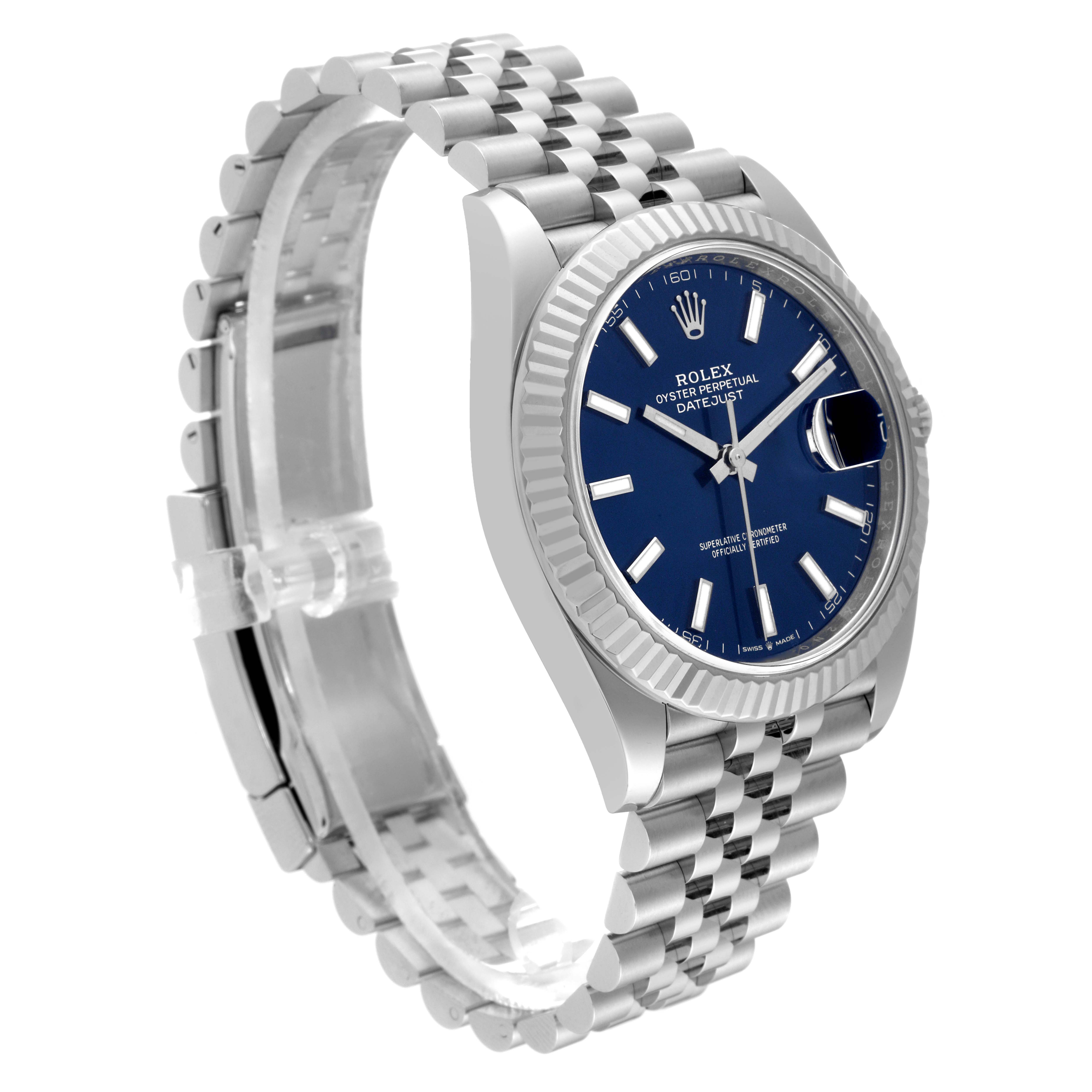 The image shows a Rolex Datejust 41 126334 Men
s Stainless Steel Blue Dial 126334 Men
s Stainless Steel Blue Dial watch at an angle displaying its blue dial, stainless steel case, and Jubilee bracelet.