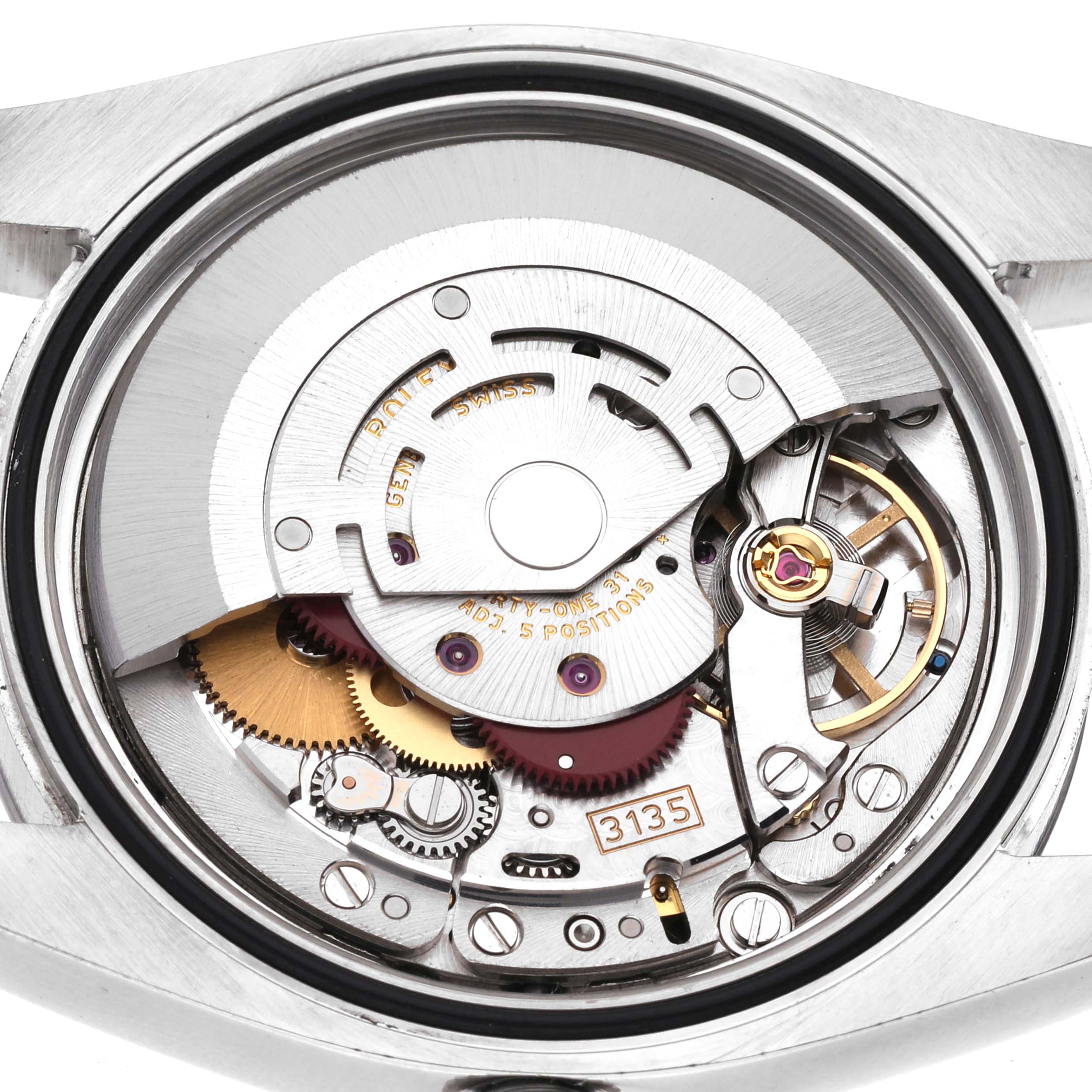 The image shows a close-up view of the movement inside a Rolex Datejust 116200 Men's Stainless Steel Black Dial 116200 Men's Stainless Steel Black Dial watch, highlighting its intricate mechanisms.