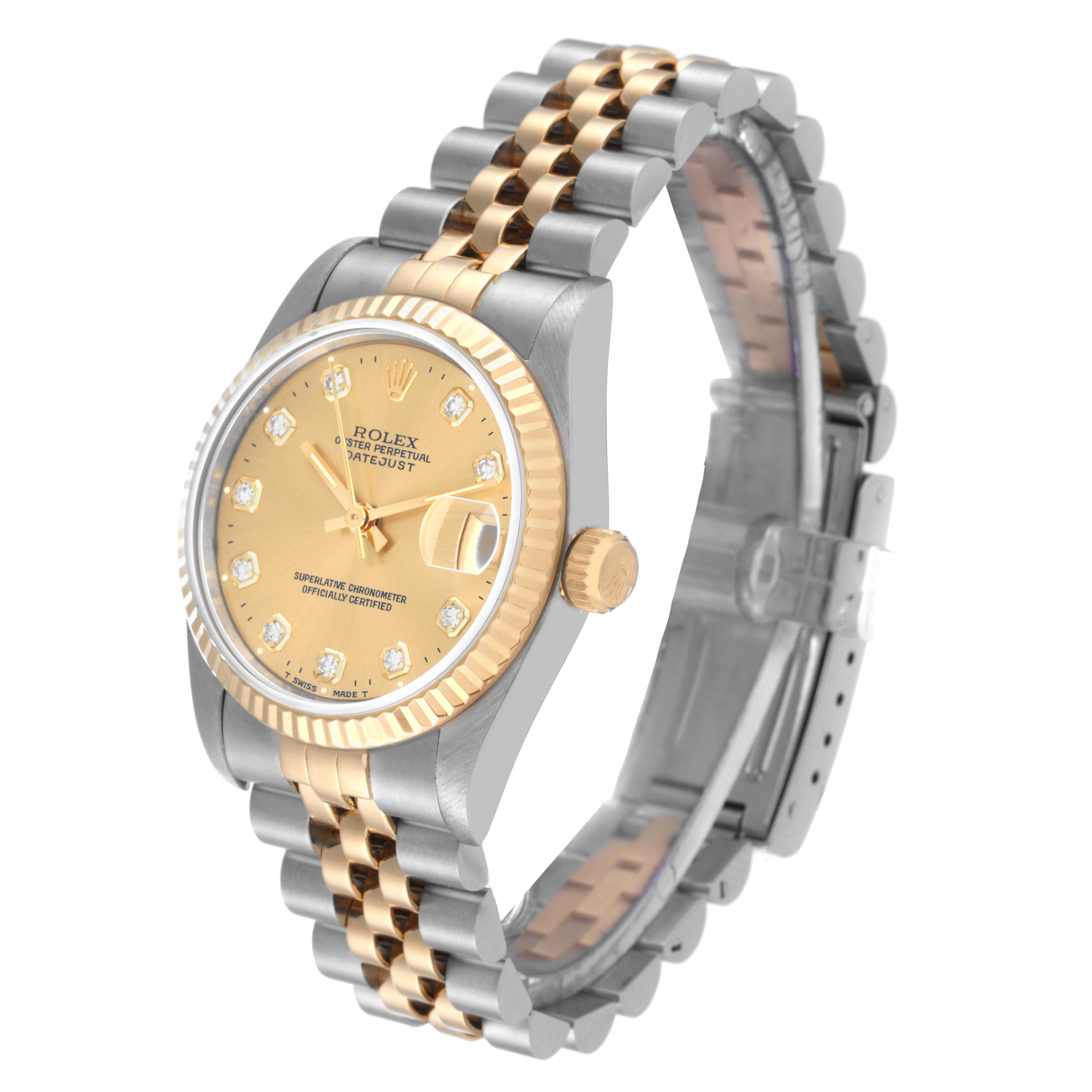 The image shows a Rolex Mid-Size 68273 Women's Steel and Gold (two tone) Champagne Dial 68273 Women's Steel and Gold (two tone) Champagne Dial Datejust watch from an angled side view, highlighting the face, crown, and two-tone jubilee bracelet.