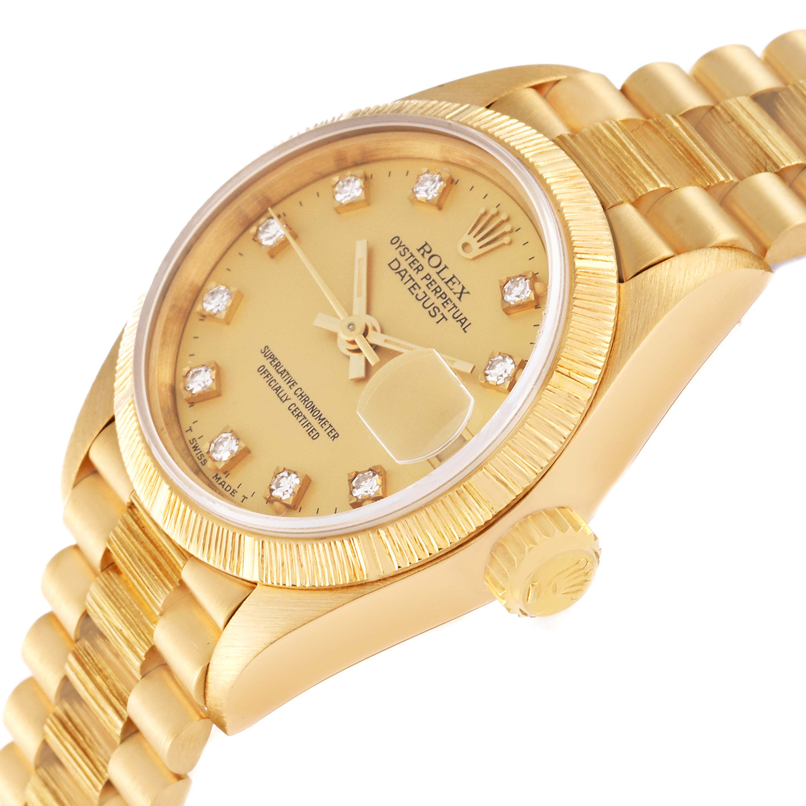 This image shows a close-up angle of the Rolex Datejust 69278 Women's Yellow Gold Champagne Dial 69278 Women's Yellow Gold Champagne Dial's face, crown, bezel, and part of the bracelet in gold.