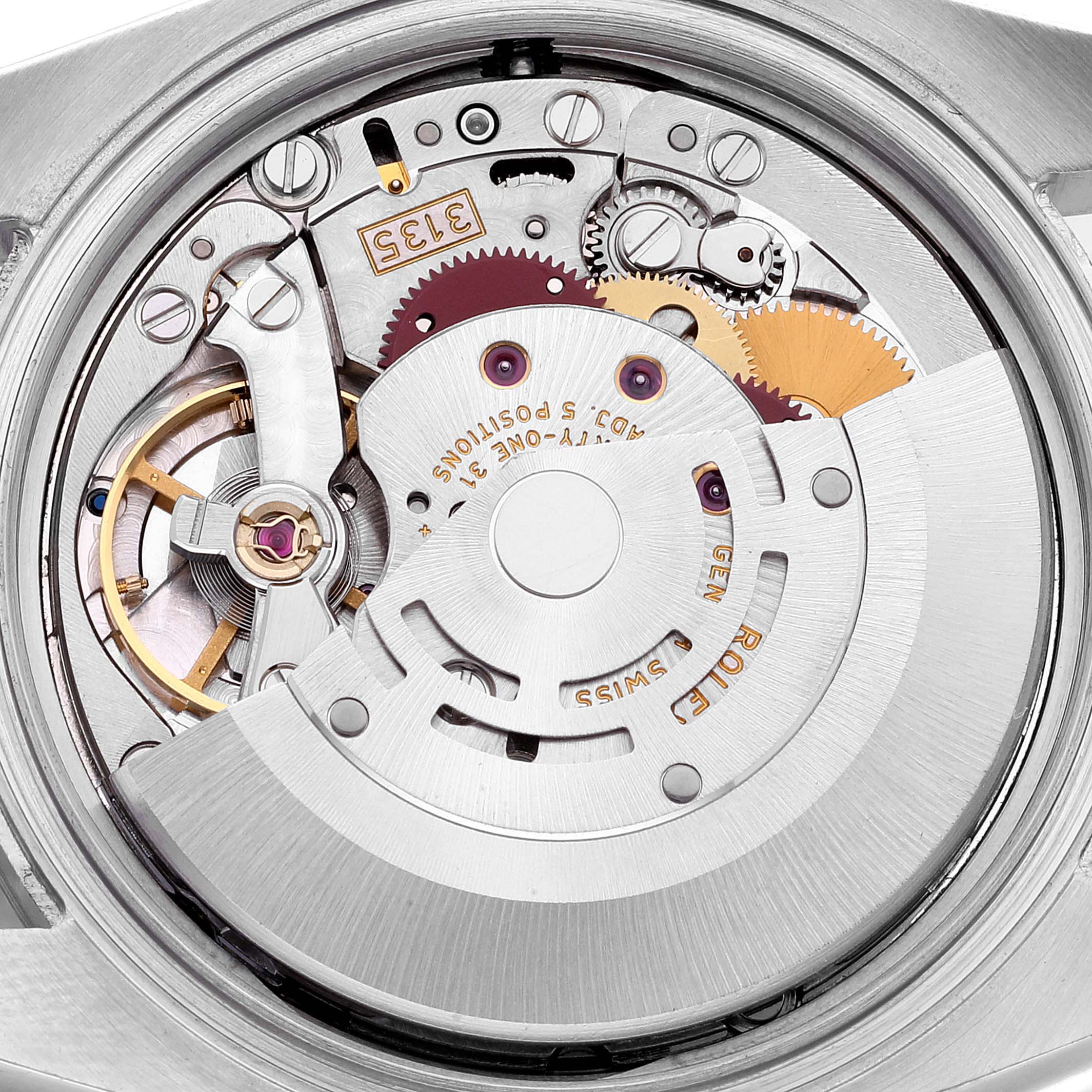 This image shows the internal mechanism of a Rolex Datejust 116234 Men's Stainless Steel Black Dial 116234 Men's Stainless Steel Black Dial watch from a close-up, top-down angle.