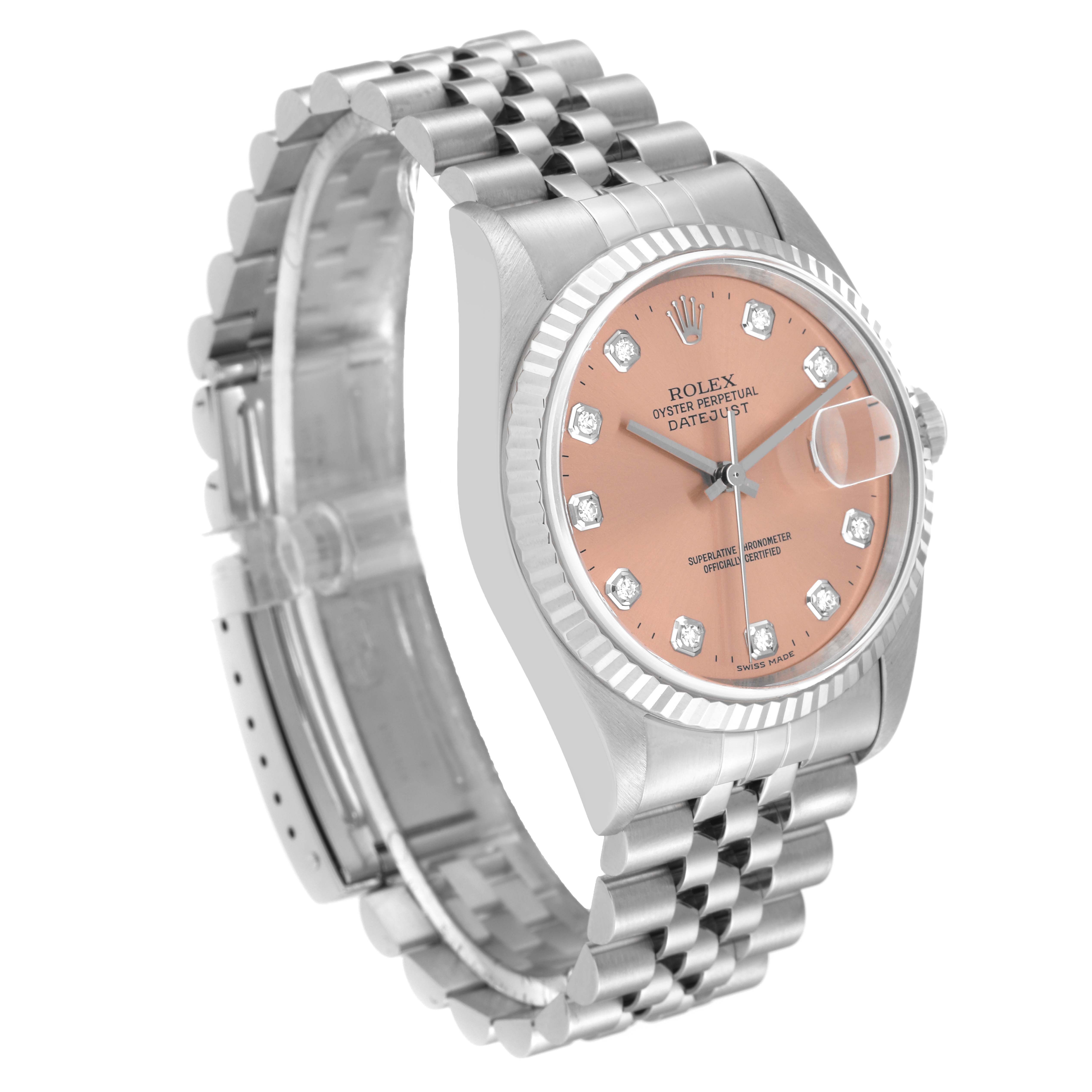 This image shows a Rolex Datejust 16234 Men's Stainless Steel Pink Dial 16234 Men's Stainless Steel Pink Dial watch angled to display its pink dial, bracelet, and side crown.