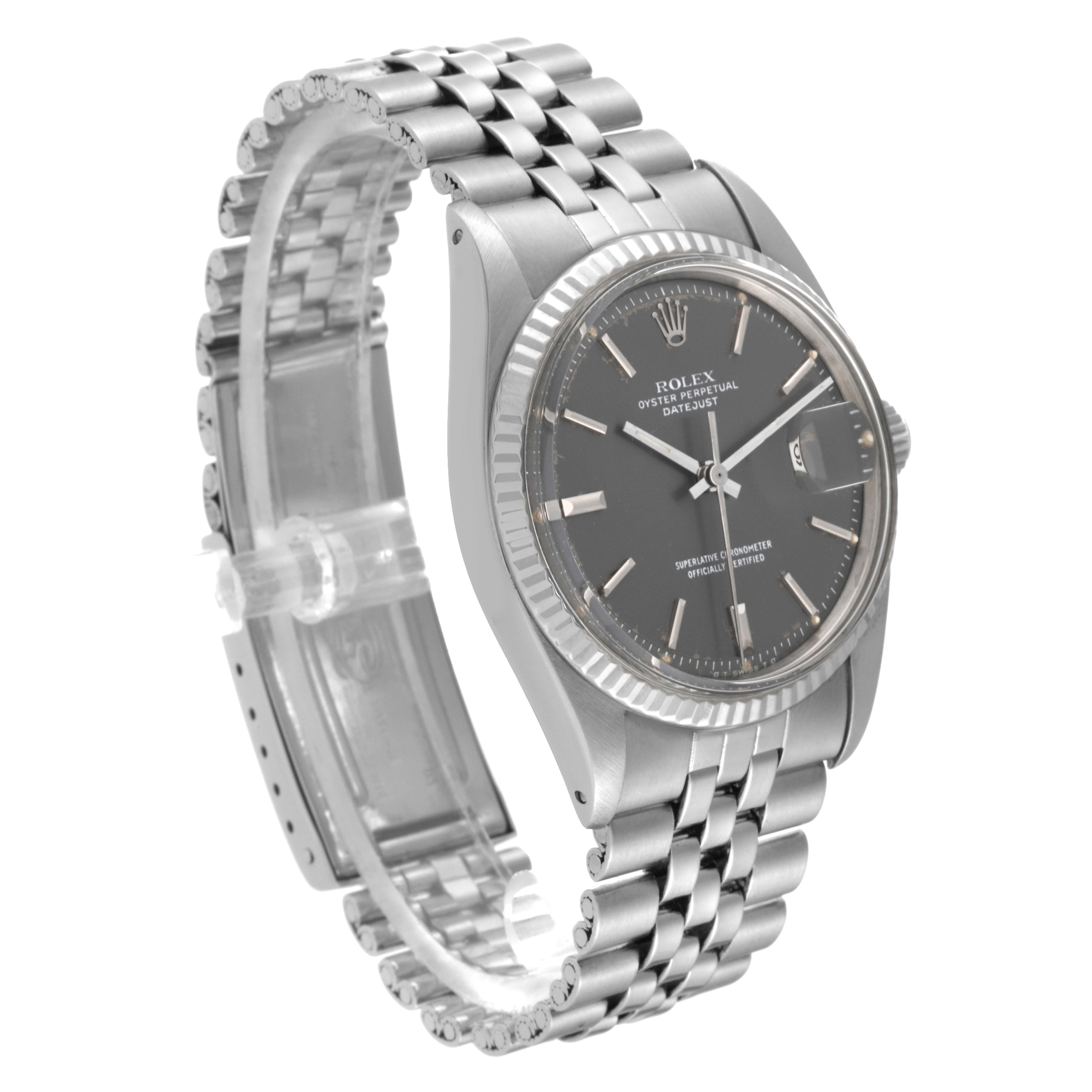 The Vintage Collection Rolex watch is shown at a slight angle, highlighting the dial, bezel, case, and metal bracelet.