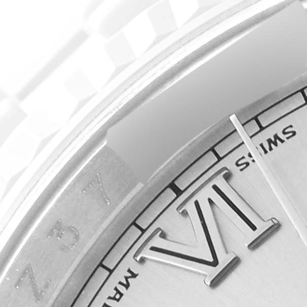 This close-up angle shows the dial, Roman numeral VI, and part of the bezel of the Rolex Datejust 116234 Men's Stainless Steel Silver Dial 116234 Men's Stainless Steel Silver Dial watch.
