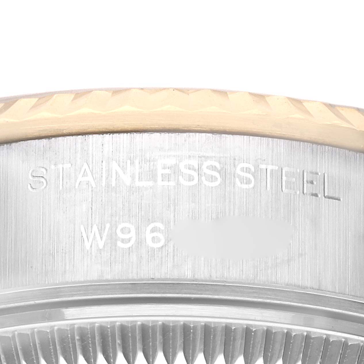 This close-up shows the side view of the stainless steel case and bezel of a Rolex Datejust 69173 Women's Steel and Gold (two tone) Champagne Dial 69173 Women's Steel and Gold (two tone) Champagne Dial watch.