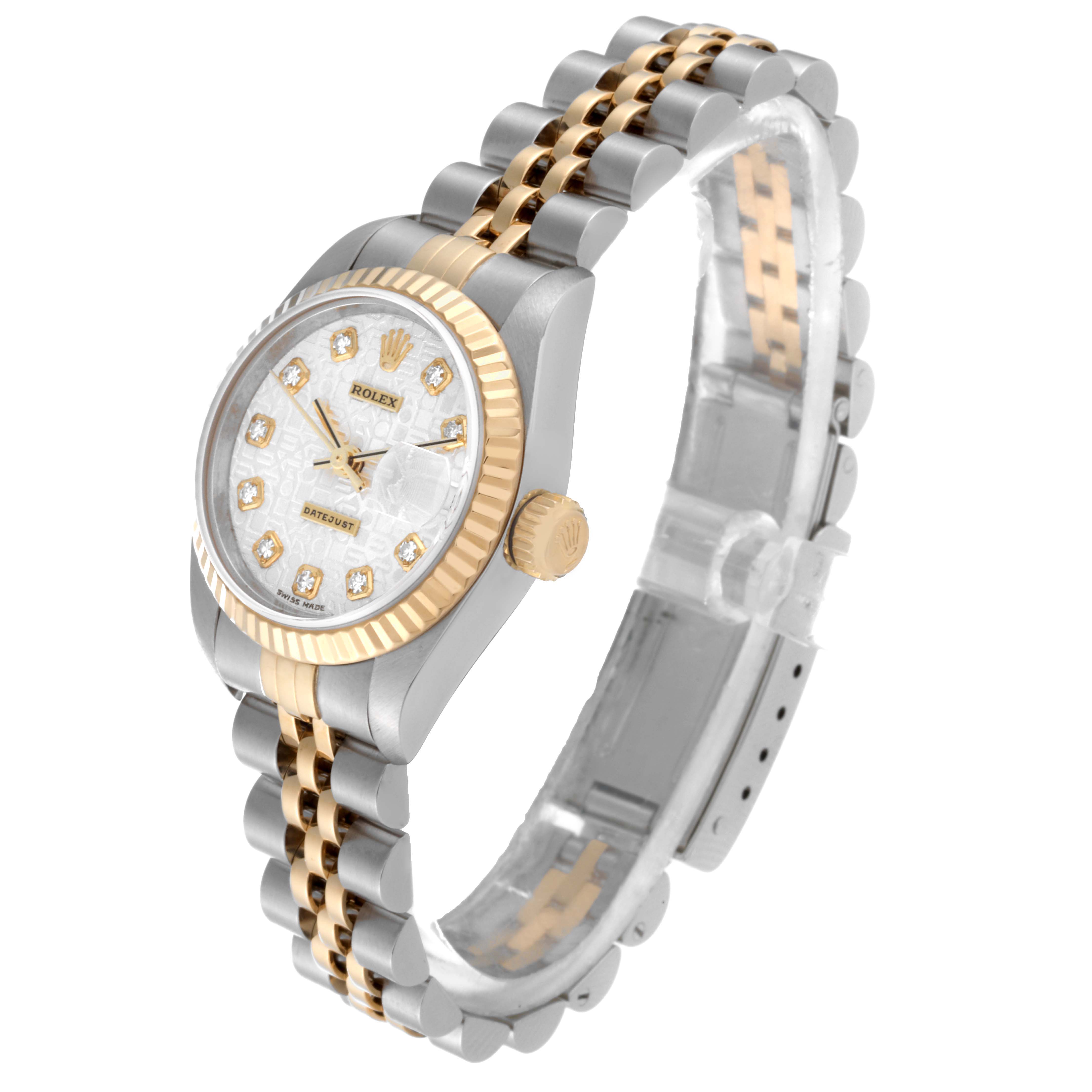 Rendered from an angled view, the Rolex Datejust 79173 Women's Steel and Gold (two tone) Silver Dial 79173 Women's Steel and Gold (two tone) Silver Dial watch showcases its face, bezel, crown, and part of the bracelet.