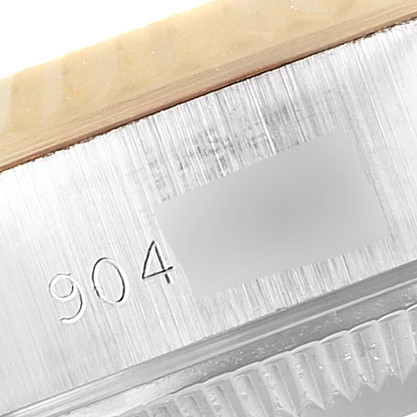 This close-up shows the serial number engraving on the side of the case of a Rolex Datejust 69173 Women
s Steel and Gold (two tone) Silver Dial 69173 Women
s Steel and Gold (two tone) Silver Dial watch.