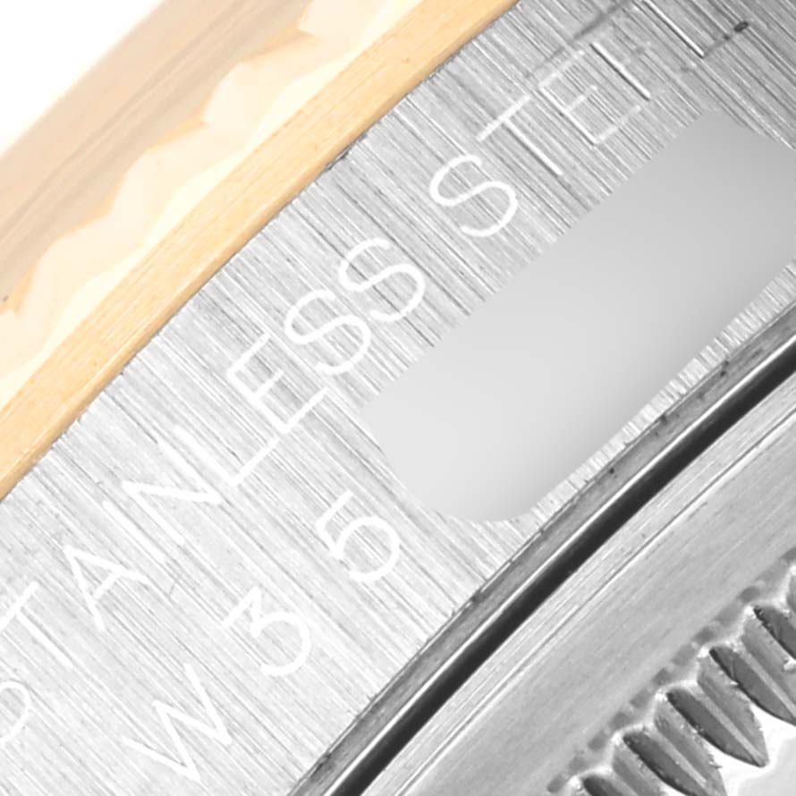 The image shows a close-up of the bezel and part of the stainless steel case of a Rolex Datejust 16233 Men
s Steel and Gold (two tone) Grey Dial 16233 Men
s Steel and Gold (two tone) Grey Dial watch.