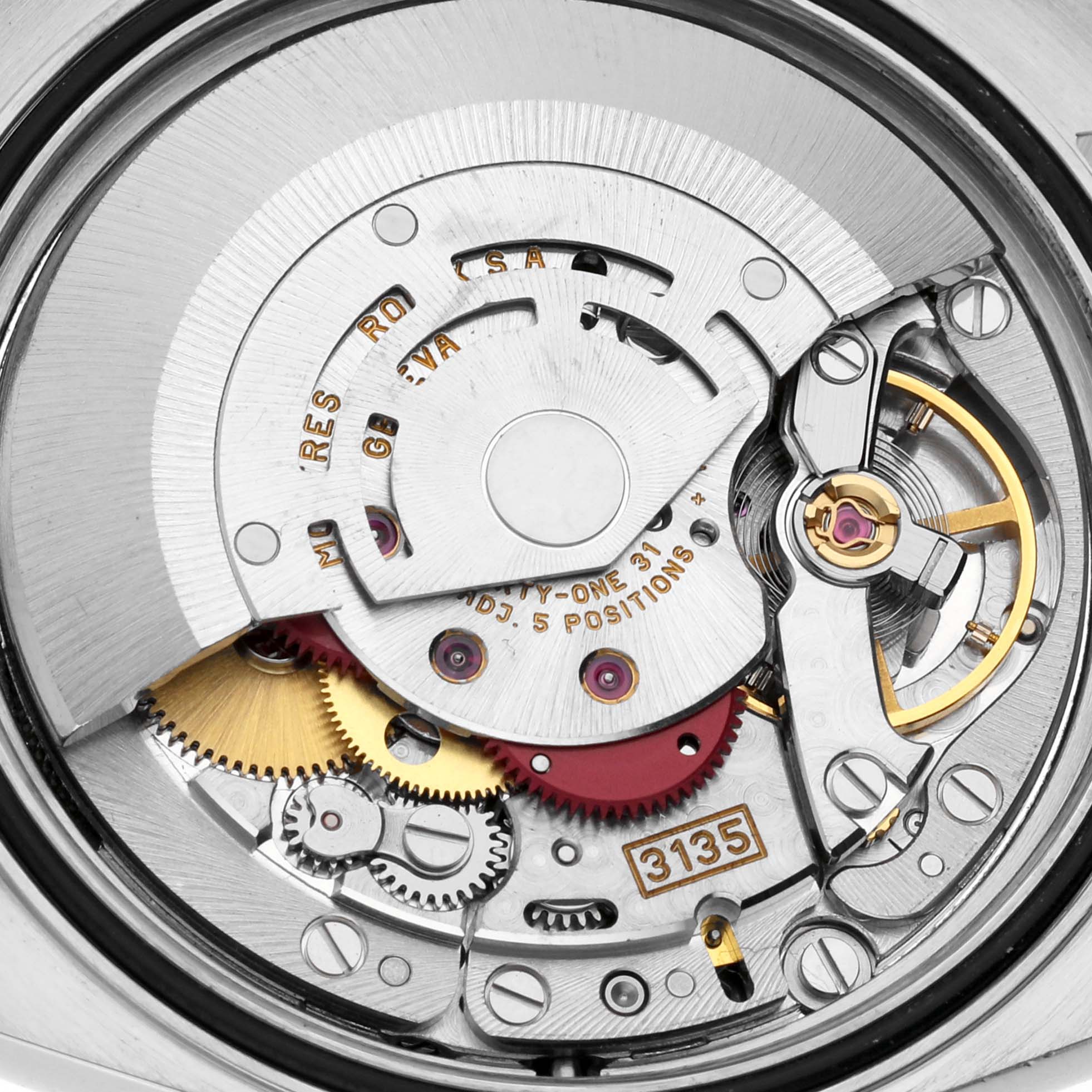 This is a close-up view of the Rolex Datejust 16233 Men
s Steel and Gold (two tone) Grey Dial 16233 Men
s Steel and Gold (two tone) Grey Dial watch
s internal mechanism, specifically showing its movement components.