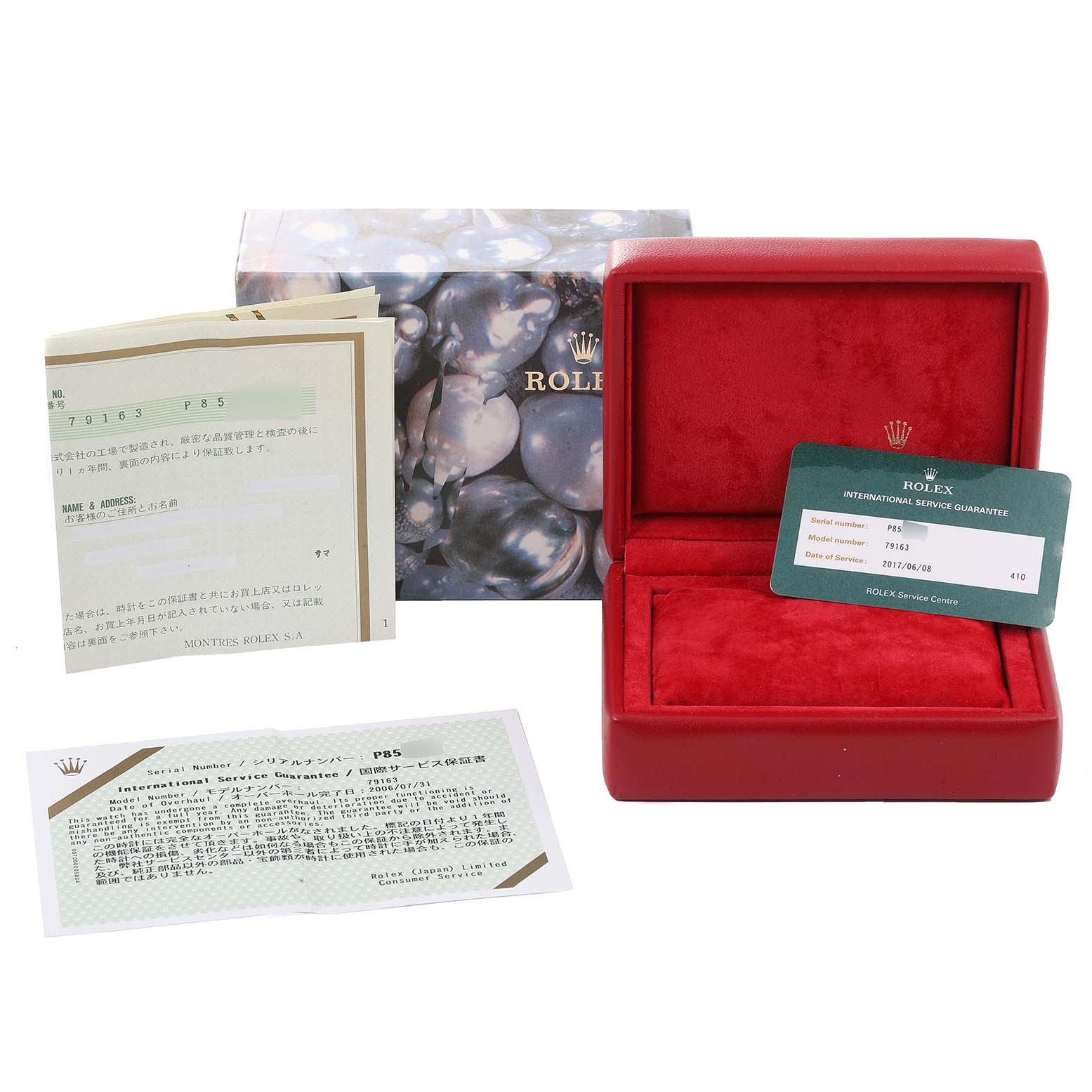 This image shows the box, warranty card, guarantee booklet, and original papers for a Rolex Datejust 79163 Women's Steel and Gold (two tone) Silver Dial 79163 Women's Steel and Gold (two tone) Silver Dial watch.