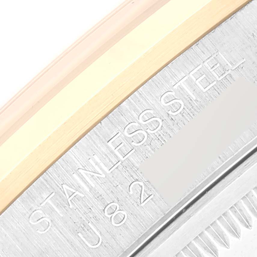 This close-up shows the side of the case and bezel with engraving on the Rolex Datejust 16203 Men's Steel and Gold (two tone) Grey Dial 16203 Men's Steel and Gold (two tone) Grey Dial watch.