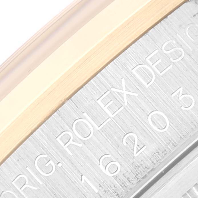 This image shows a close-up of the engraved model number and part of the bezel of a Rolex Datejust 16203 Men's Steel and Gold (two tone) Grey Dial 16203 Men's Steel and Gold (two tone) Grey Dial watch.