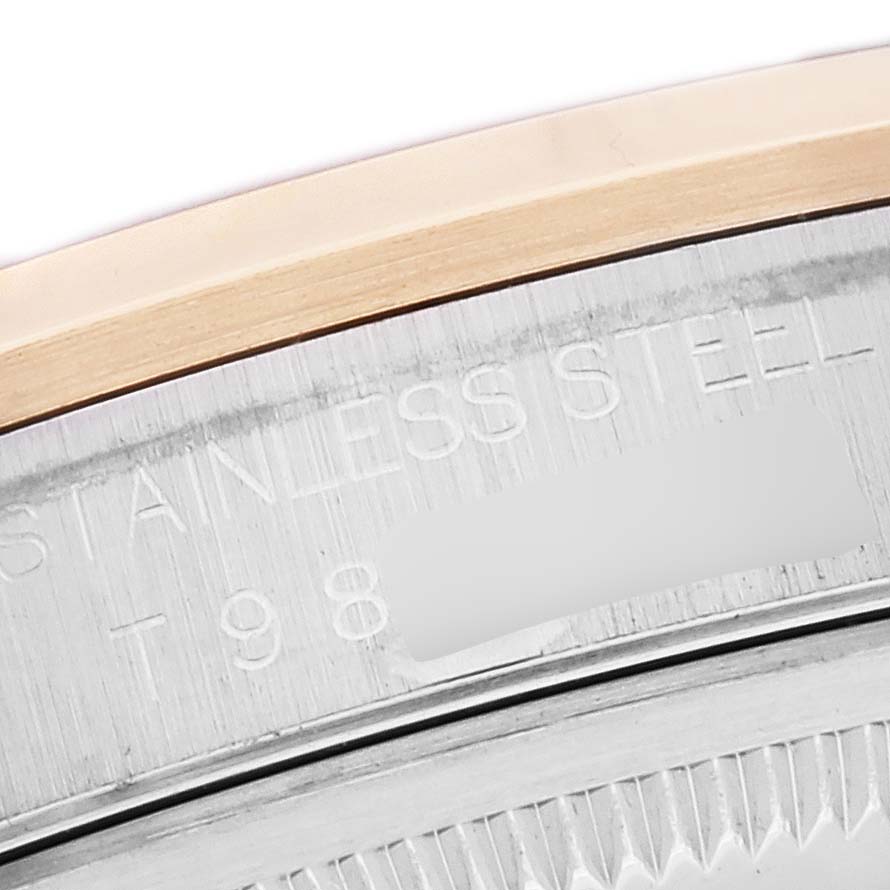 This close-up shows the edge and part of the stainless steel back of a Rolex Datejust 16203 Men's Steel and Gold (two tone) Grey Dial 16203 Men's Steel and Gold (two tone) Grey Dial watch.