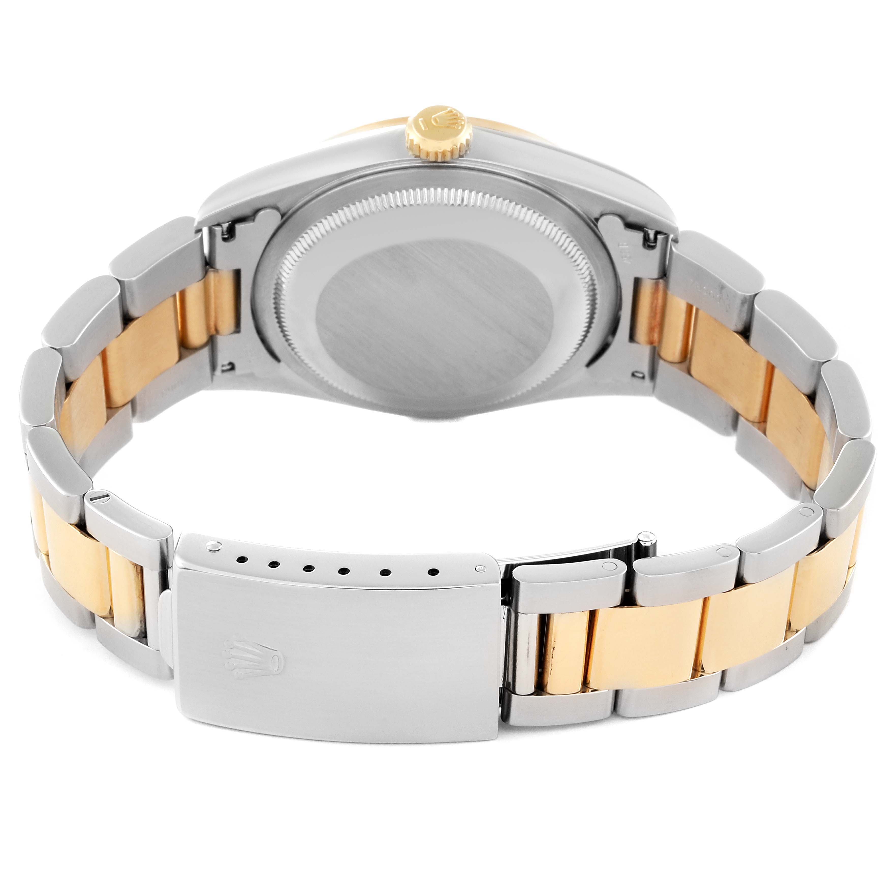 This image shows the back and clasp of a Rolex Datejust 16203 Men's Steel and Gold (two tone) Grey Dial 16203 Men's Steel and Gold (two tone) Grey Dial watch, displaying its two-tone bracelet and caseback.