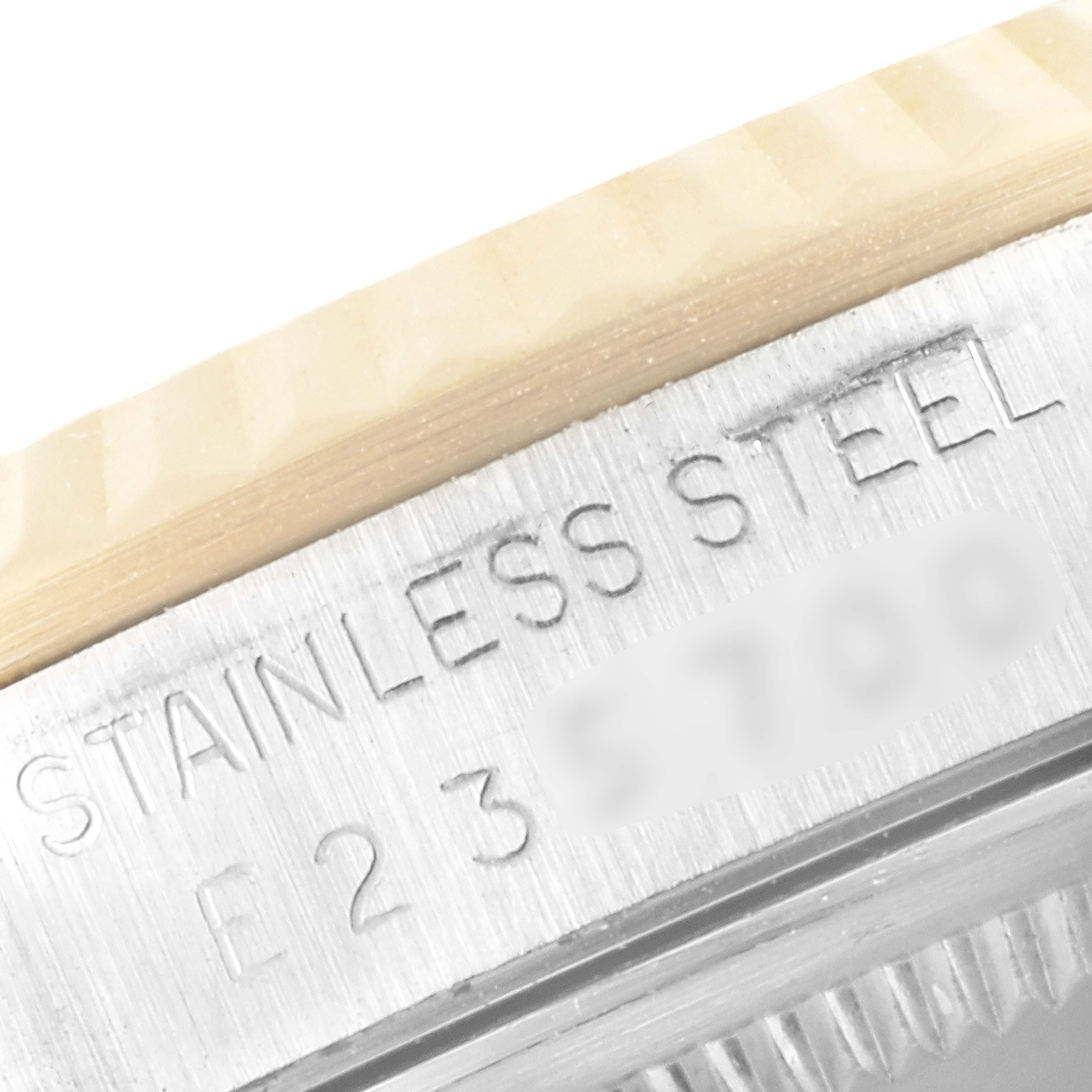 The image shows a close-up of the stainless steel part of the Rolex Datejust 16233 Men's Steel and Gold (two tone) White Dial 16233 Men's Steel and Gold (two tone) White Dial watch case with engraved serial numbers.
