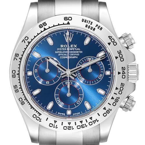 The Rolex Daytona watch is shown from a front angle, highlighting its blue dial, three sub-dials, and stainless steel bezel.