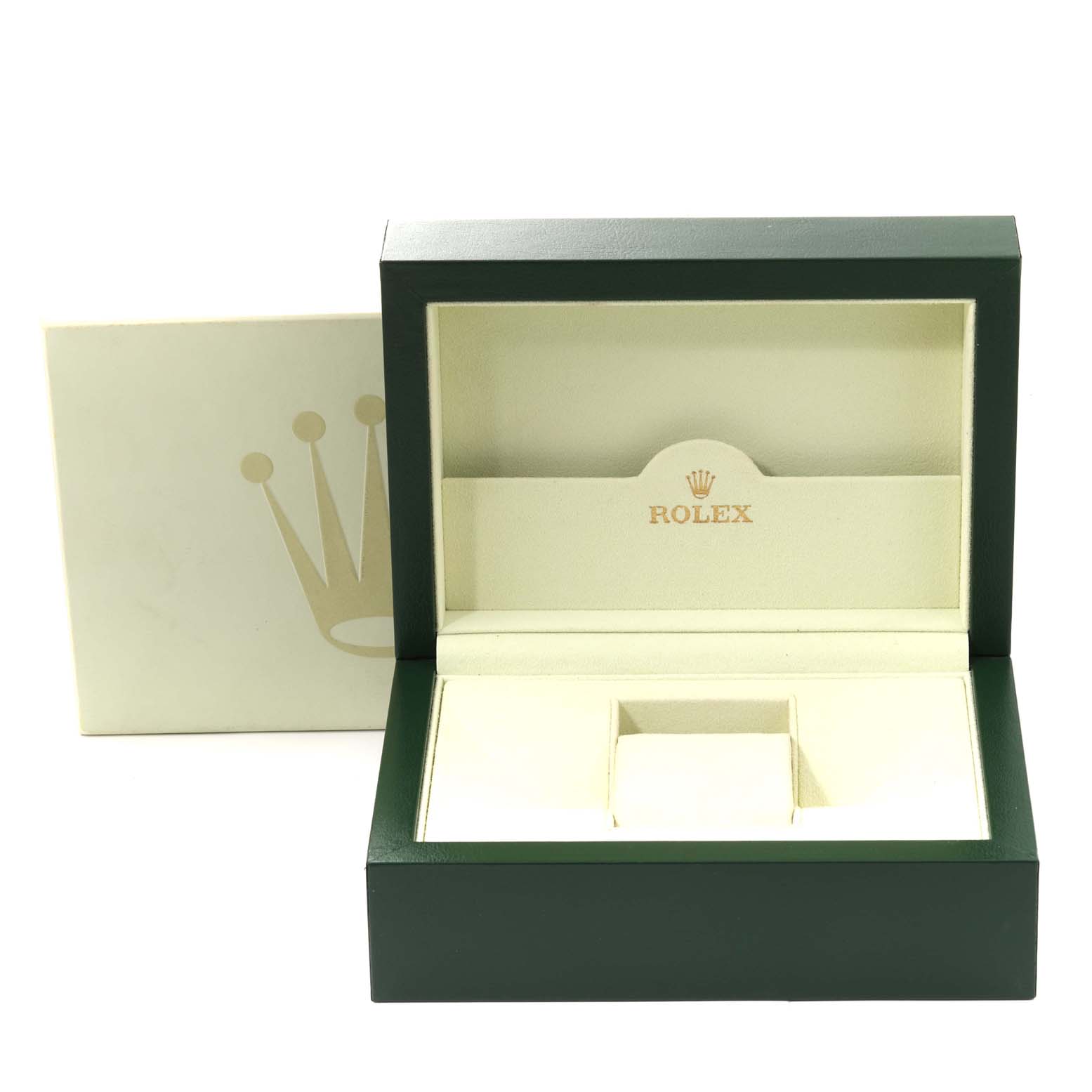 The image shows an open Rolex watch box for the Daytona model, showcasing its interior lining and compartments.