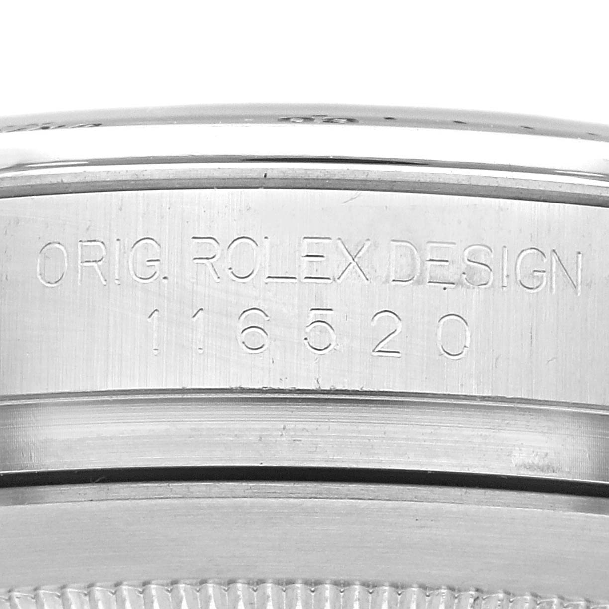 The image shows a close-up of the case back of a Rolex Daytona 116520 Men's Stainless Steel White Dial 116520 Men's Stainless Steel White Dial watch, highlighting the engraved model number.