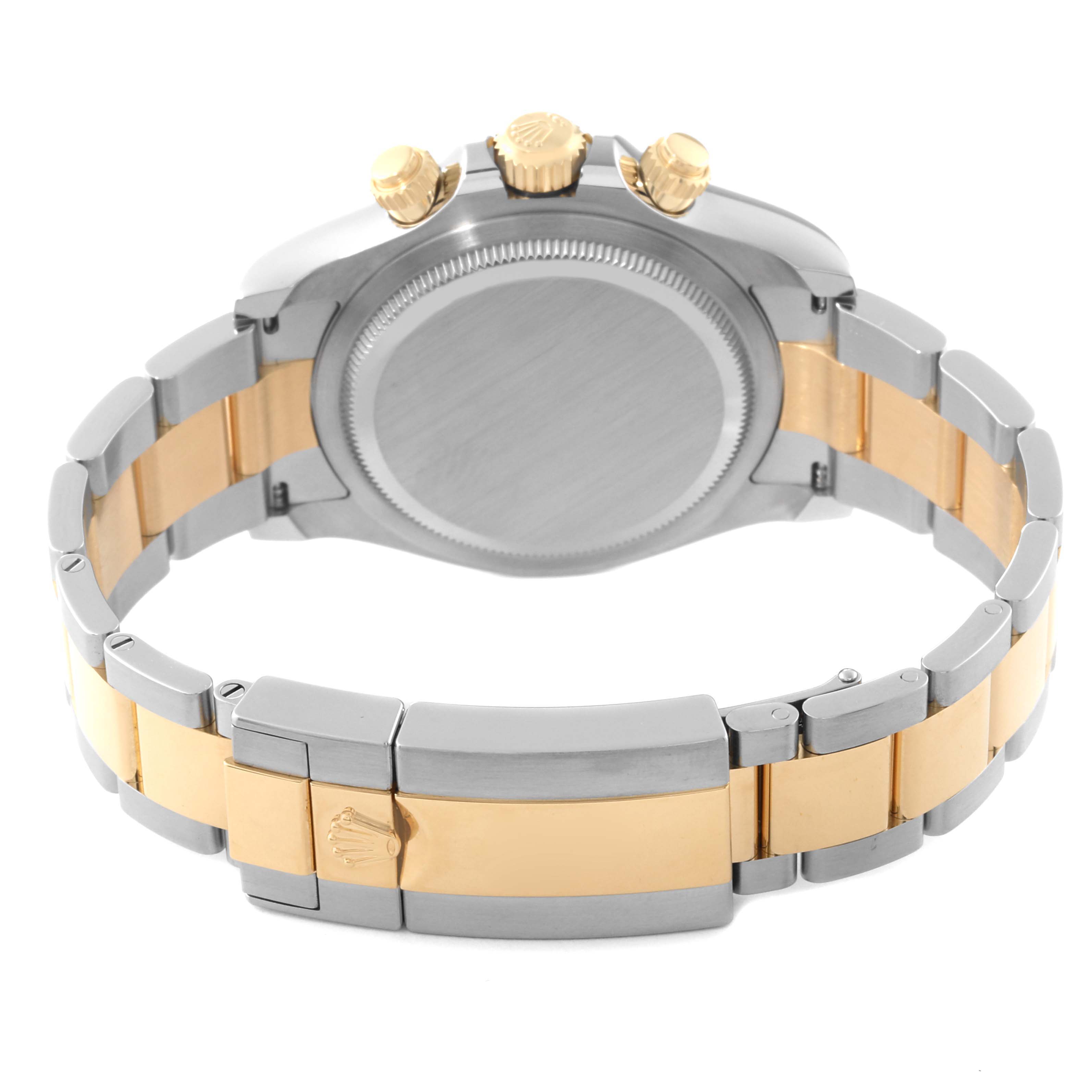 This is an image of the back and side view of a Rolex Daytona 126503 Men's Steel and Gold (two tone) White Dial 126503 Men's Steel and Gold (two tone) White Dial, showing the case, clasp, and bracelet with golden accents.