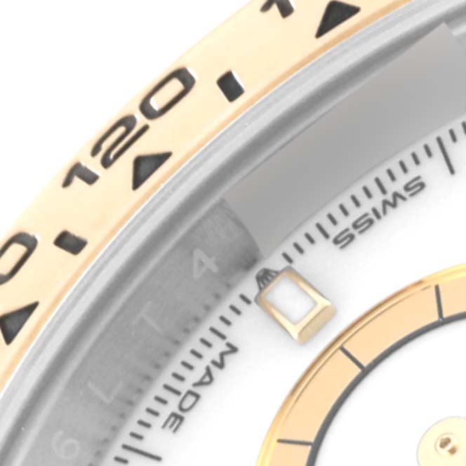 This image shows a close-up of the bezel, dial, and markers of a Rolex Daytona 126503 Men's Steel and Gold (two tone) White Dial 126503 Men's Steel and Gold (two tone) White Dial watch.