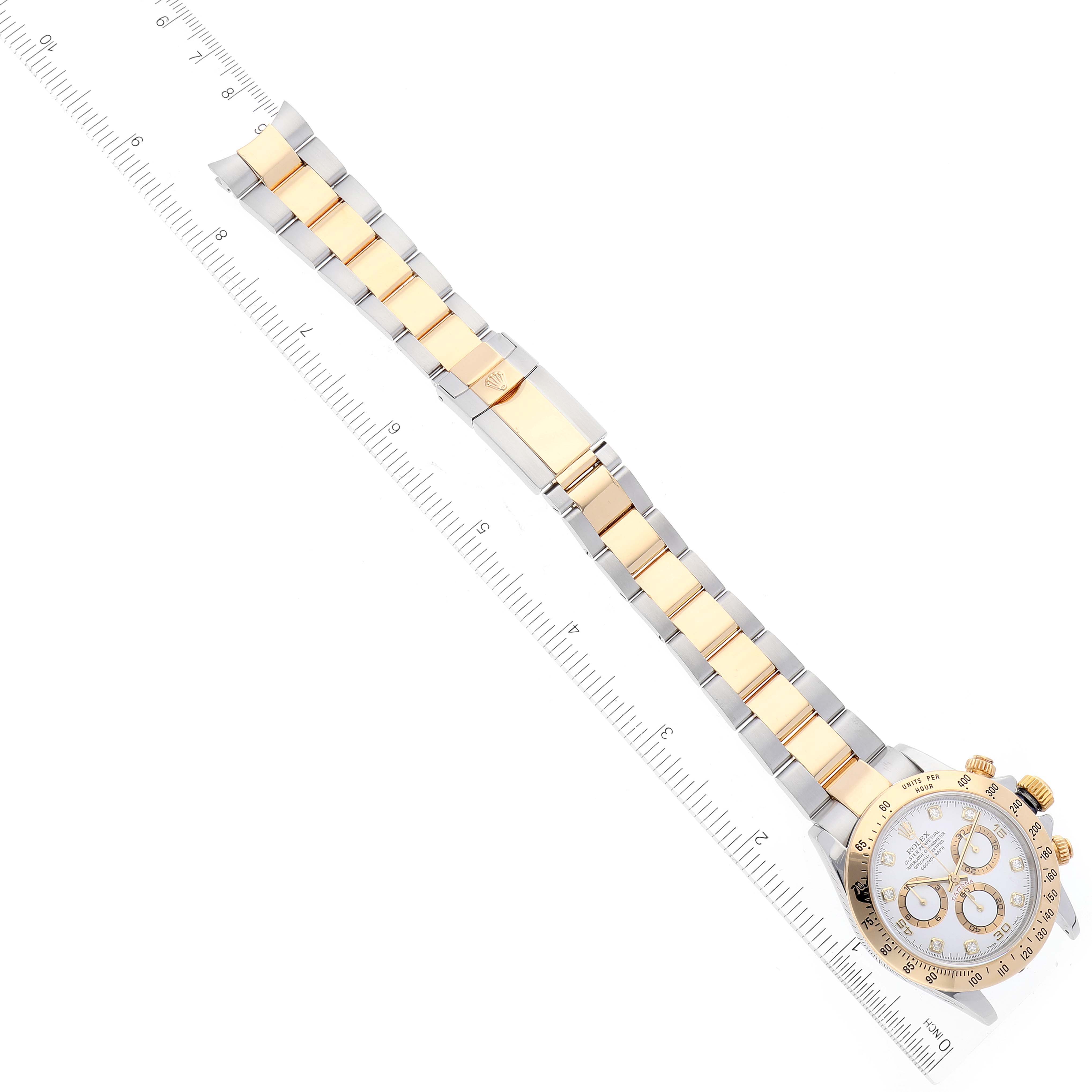 The Rolex Daytona 116523 Men
s Steel and Gold (two tone) White Dial 116523 Men
s Steel and Gold (two tone) White Dial watch is shown from an overhead angle, displaying the face, bezel, crown, pushers, and bracelet.