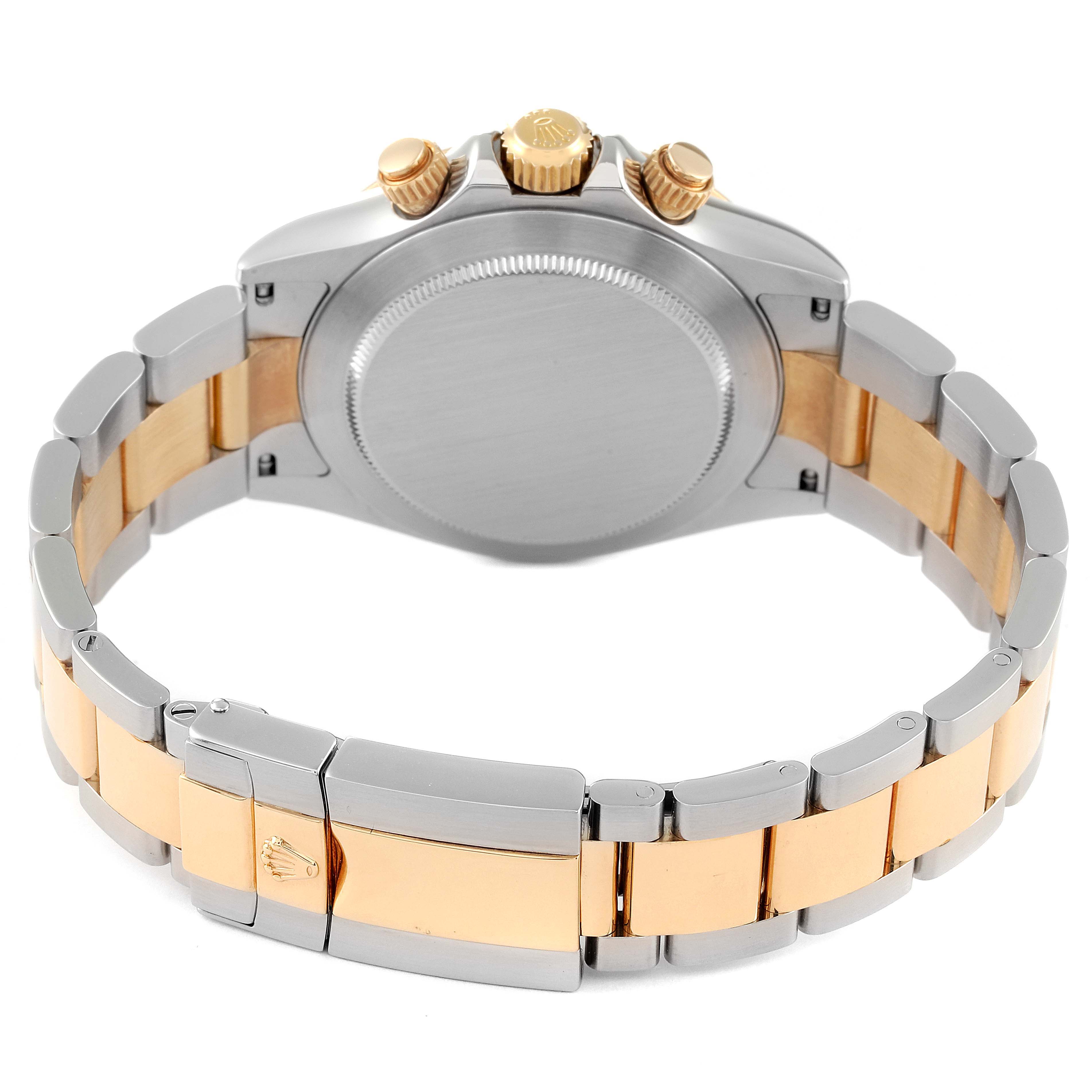 This image shows the back case and bracelet of a Rolex Daytona 116523 Men
s Steel and Gold (two tone) White Dial 116523 Men
s Steel and Gold (two tone) White Dial watch, focusing on the clasp and crown from a rear angle.